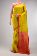Yellow Dual Tone Kanjivaram Silk Saree with Plain Body and Zari Border.  displayed on a mannequin