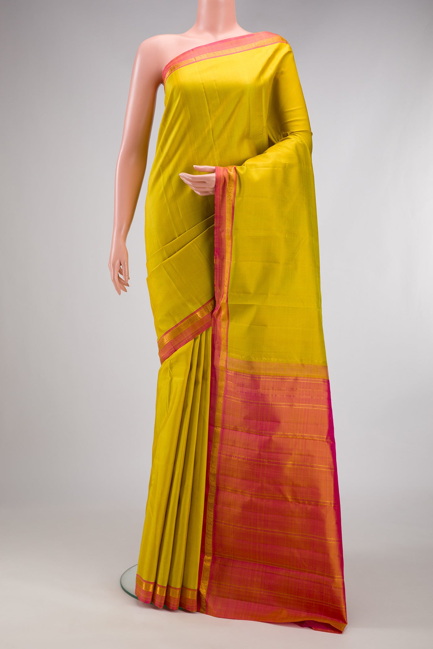 Yellow Dual Tone Kanjivaram Silk Saree with Plain Body and Zari Border.  displayed on a mannequin
