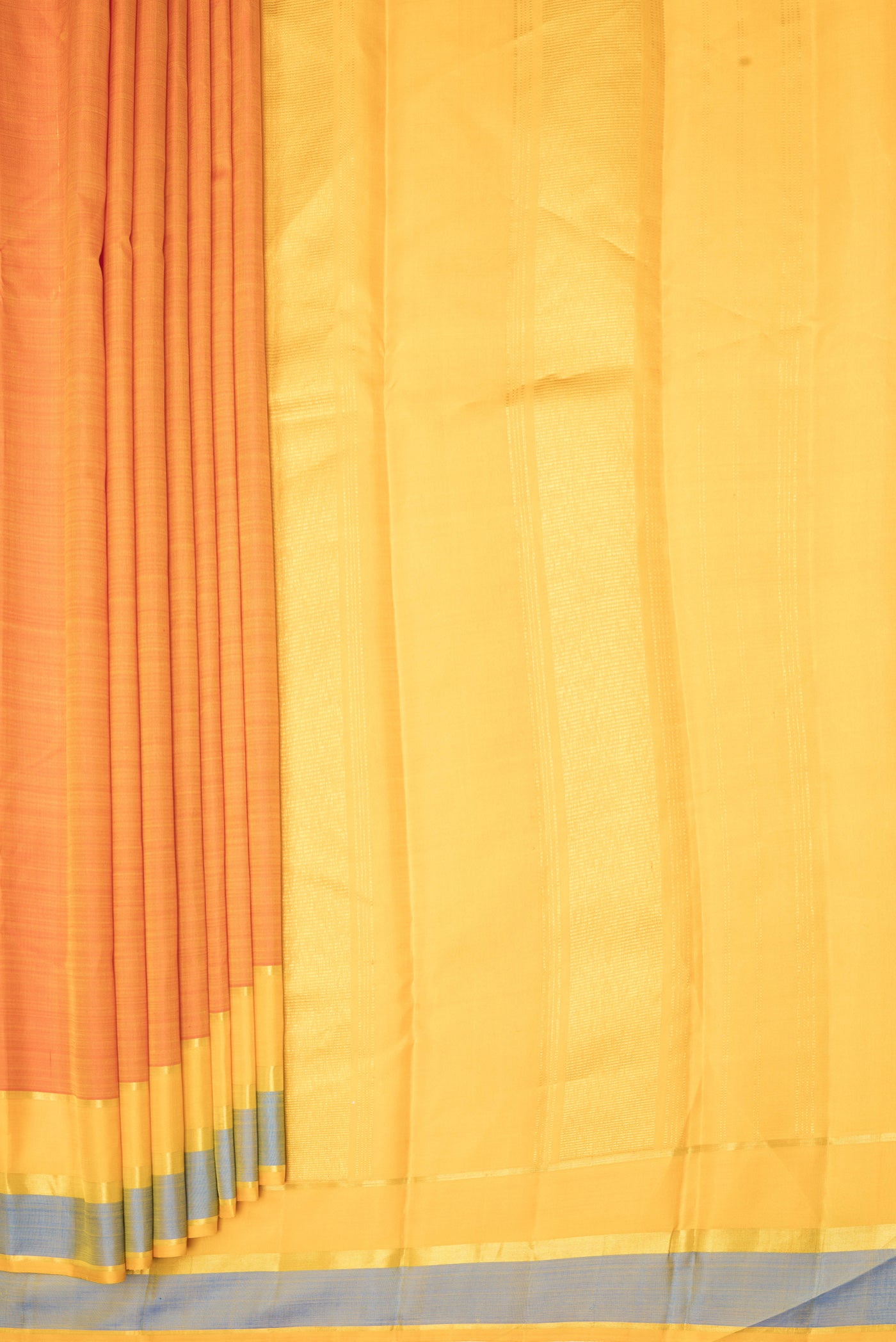 Pleats and pallu of Rust Kanjivaram Silk Saree with Plain Body and Zari Border. 