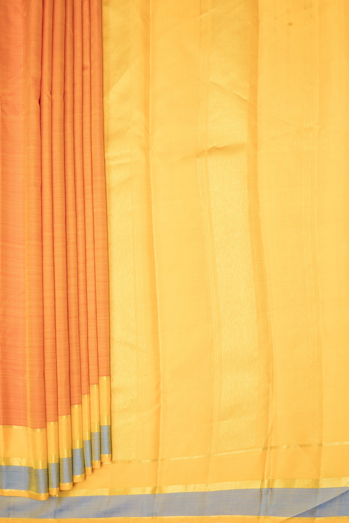 Pleats and pallu of Rust Kanjivaram Silk Saree with Plain Body and Zari Border. 