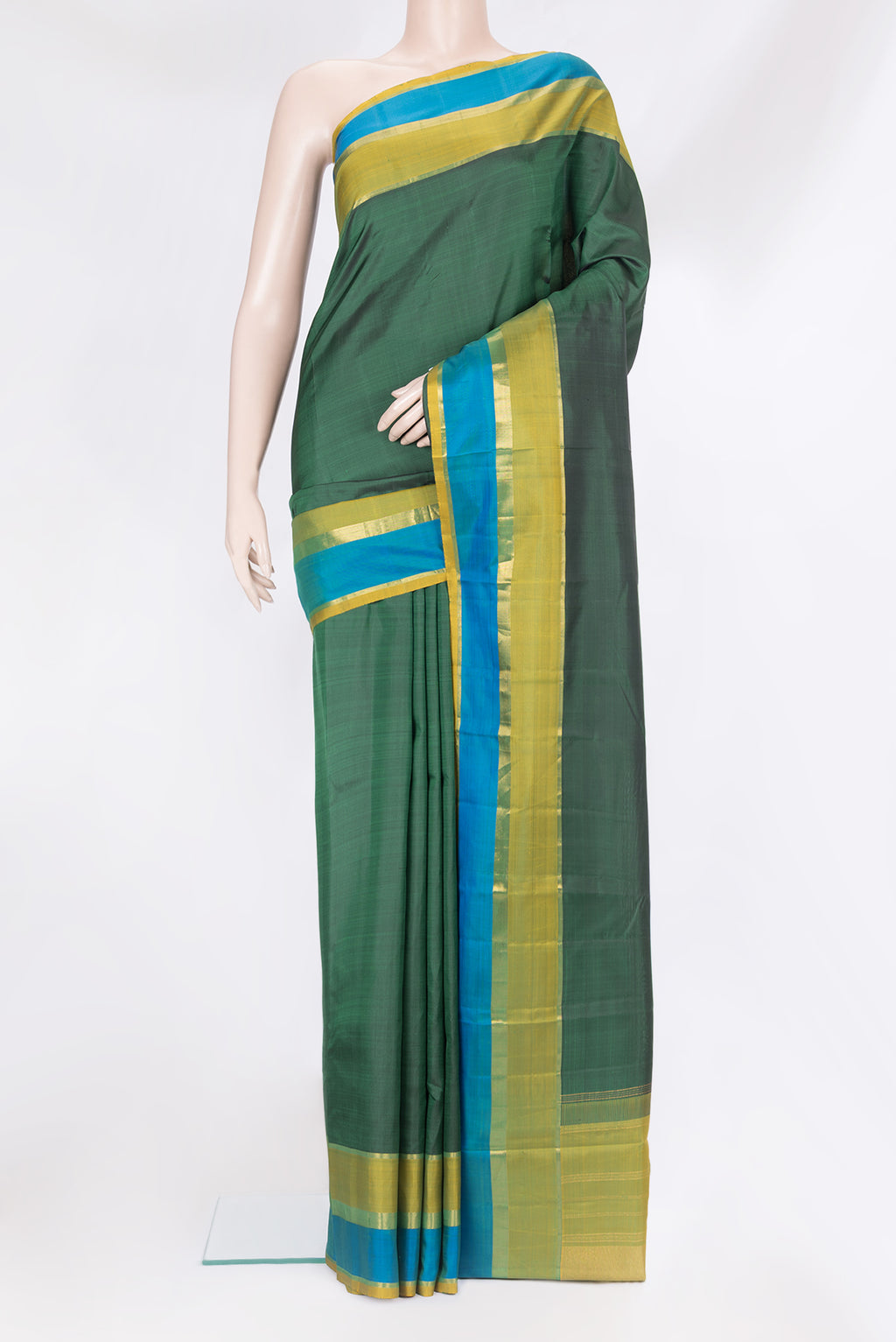 Bottle Green Kanjivaram Silk Saree with Plain Body and Zari Border.  displayed on a mannequin