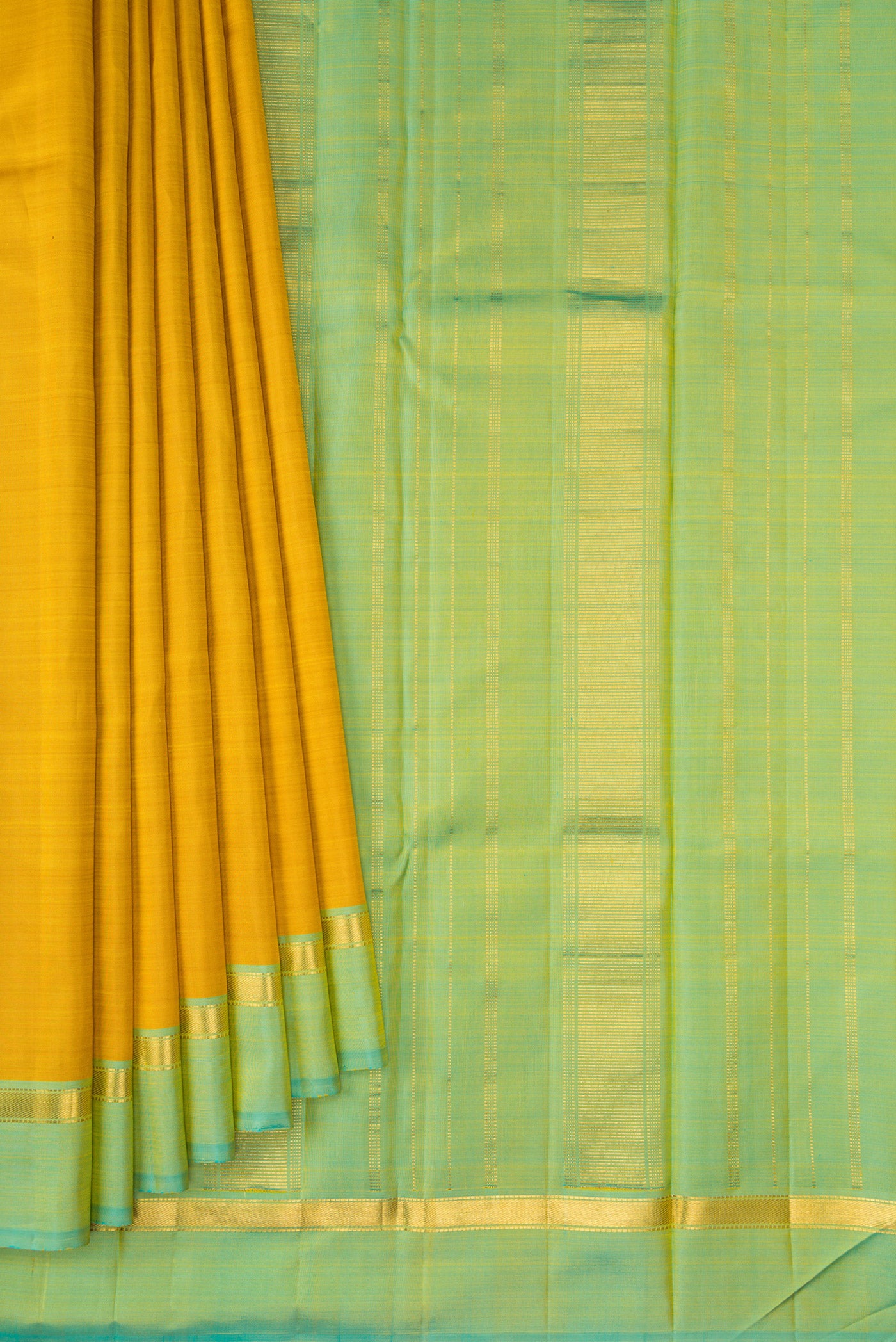 Pleats and pallu of Mustard Kanjivaram Silk Saree with Plain Body and Zari Border. 