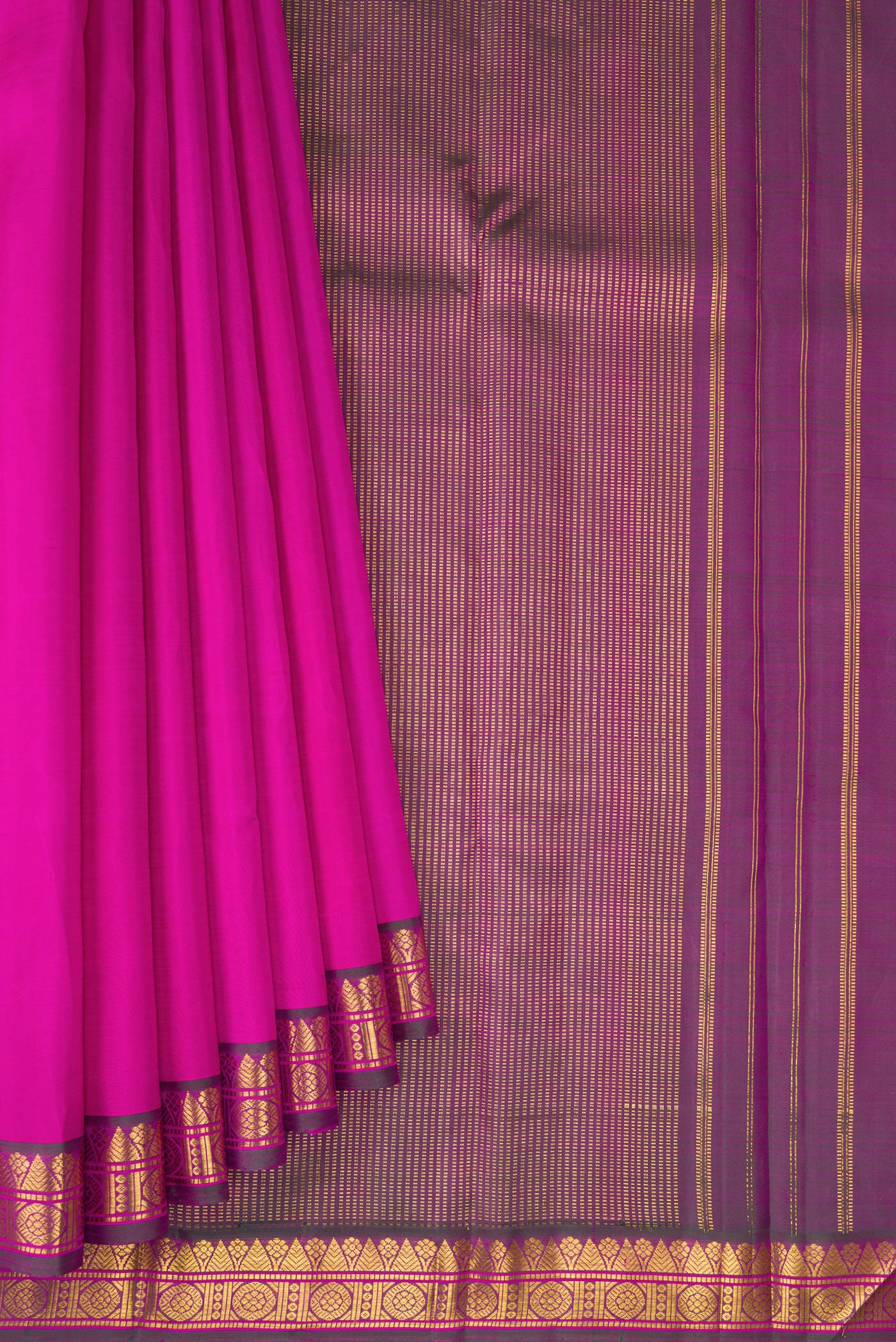 Pleats and pallu of Magenta Kanchipuram Silk Saree with Plain Body and Zari Border. 