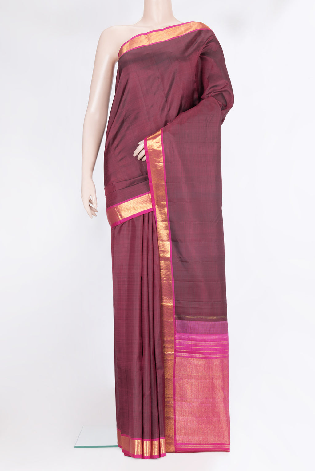 Maroon Kanchipuram Silk Saree with Plain Body and Zari Border.  displayed on a mannequin