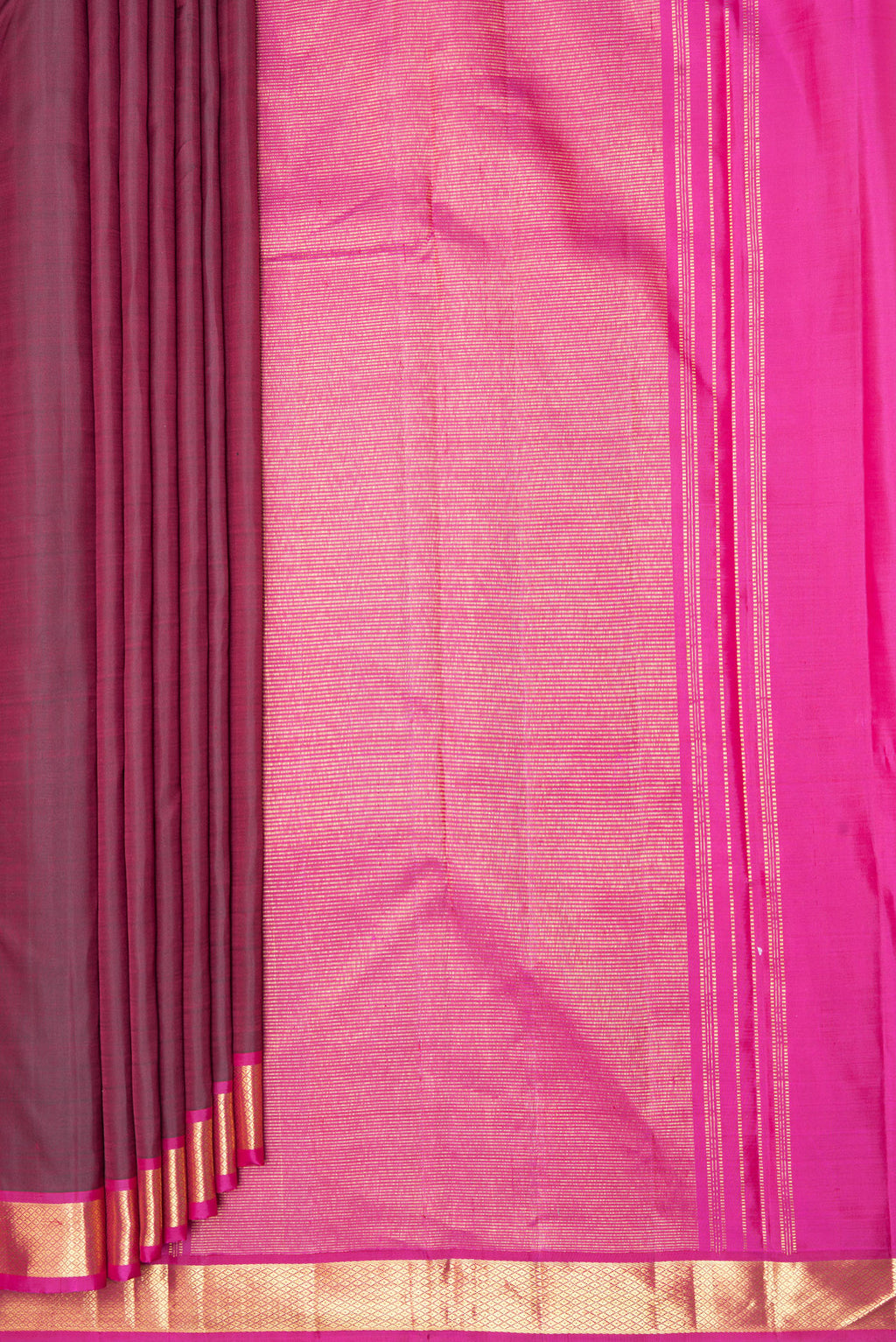 Pleats and pallu of Maroon Kanchipuram Silk Saree with Plain Body and Zari Border. 