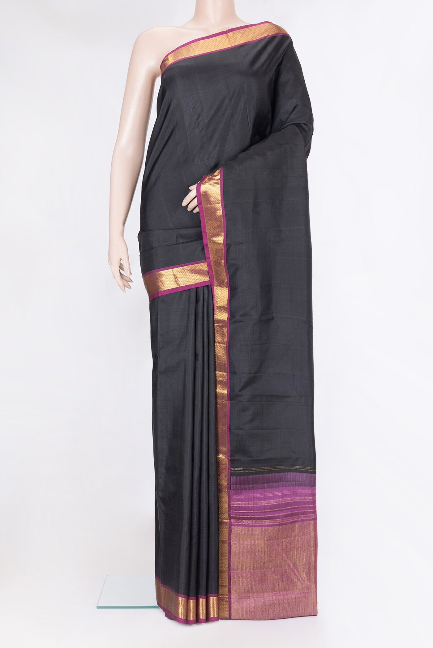 Black Kanchipuram Silk Saree with Plain Body and Zari Border.  displayed on a mannequin
