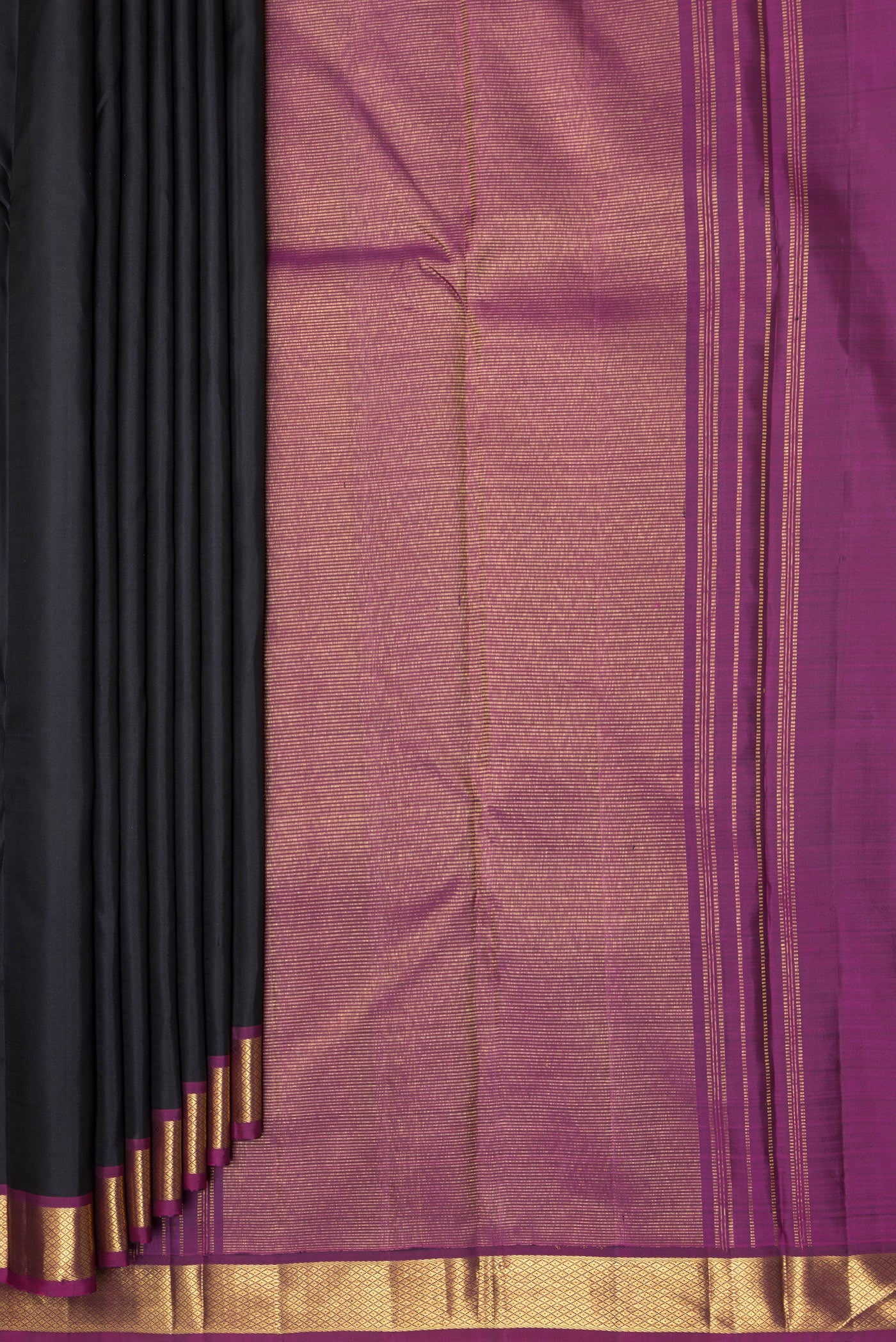 Pleats and pallu of Black Kanchipuram Silk Saree with Plain Body and Zari Border. 