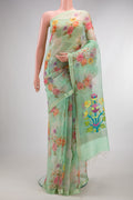 Pista Green Organza Saree with Floral Print on the body and Zari Border.  displayed on a mannequin