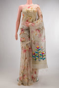 Beige Organza Saree with Printed design on the body and Zari Border.  displayed on a mannequin