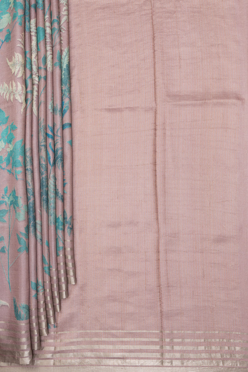 Pleats and pallu of Rose Gold Tussar Saree with Floral Print on the body and Zari Border. 