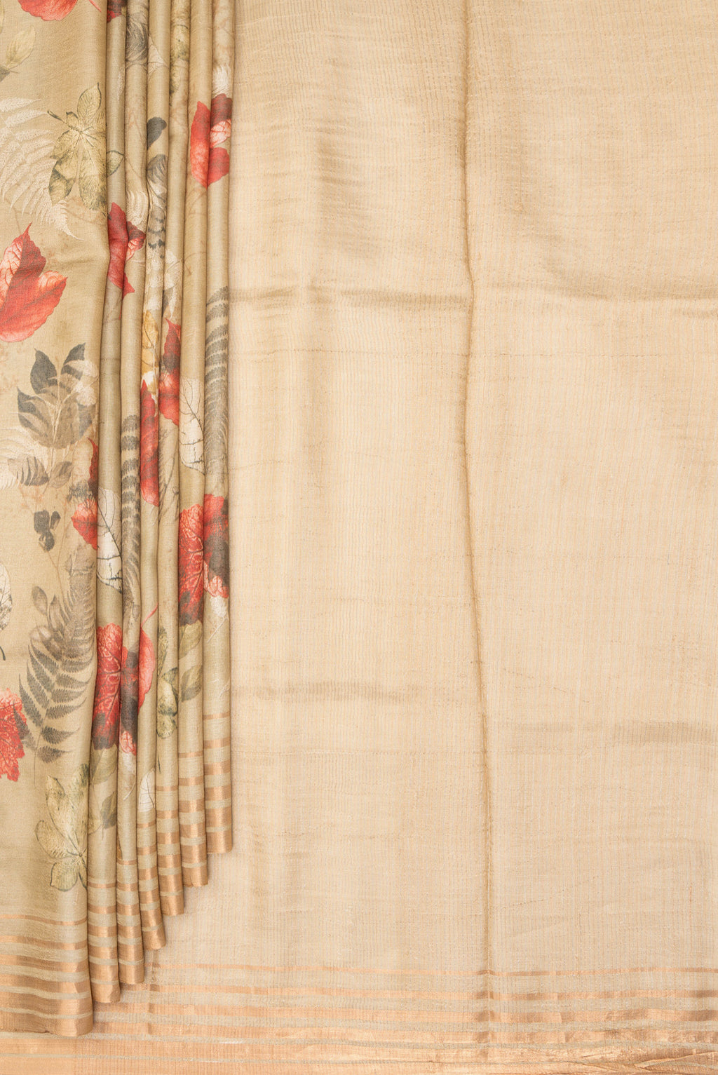 Pleats and pallu of Golden Tussar Saree with Printed design on the body and Zari Border. 