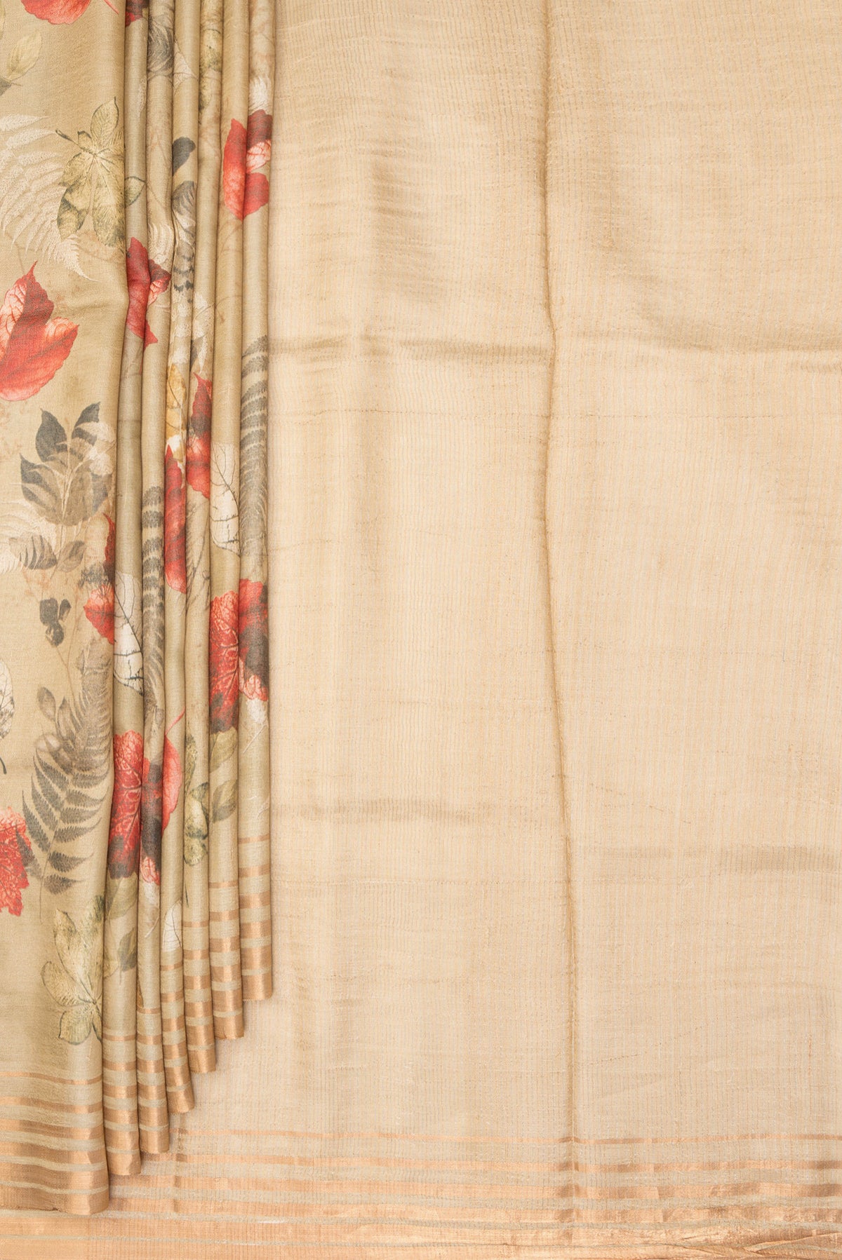 Pleats and pallu of Golden Tussar Saree with Printed design on the body and Zari Border. 
