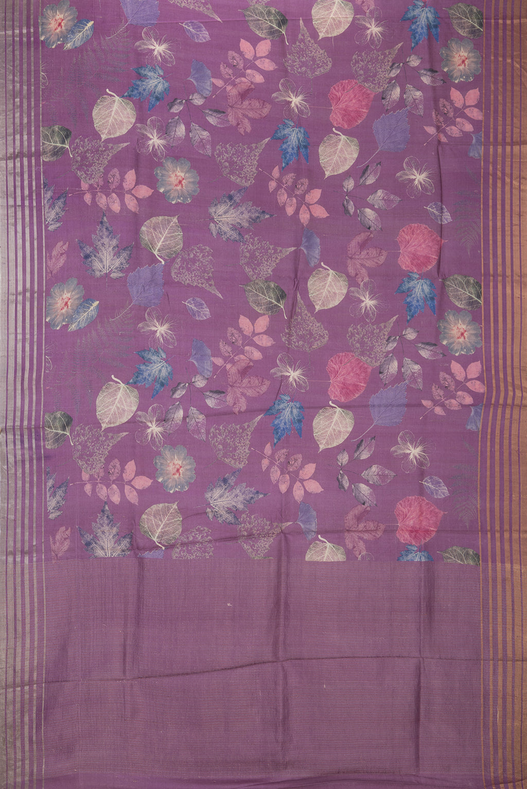 Flat view of Purple Tussar Saree with Printed design on the body and Zari Border. 