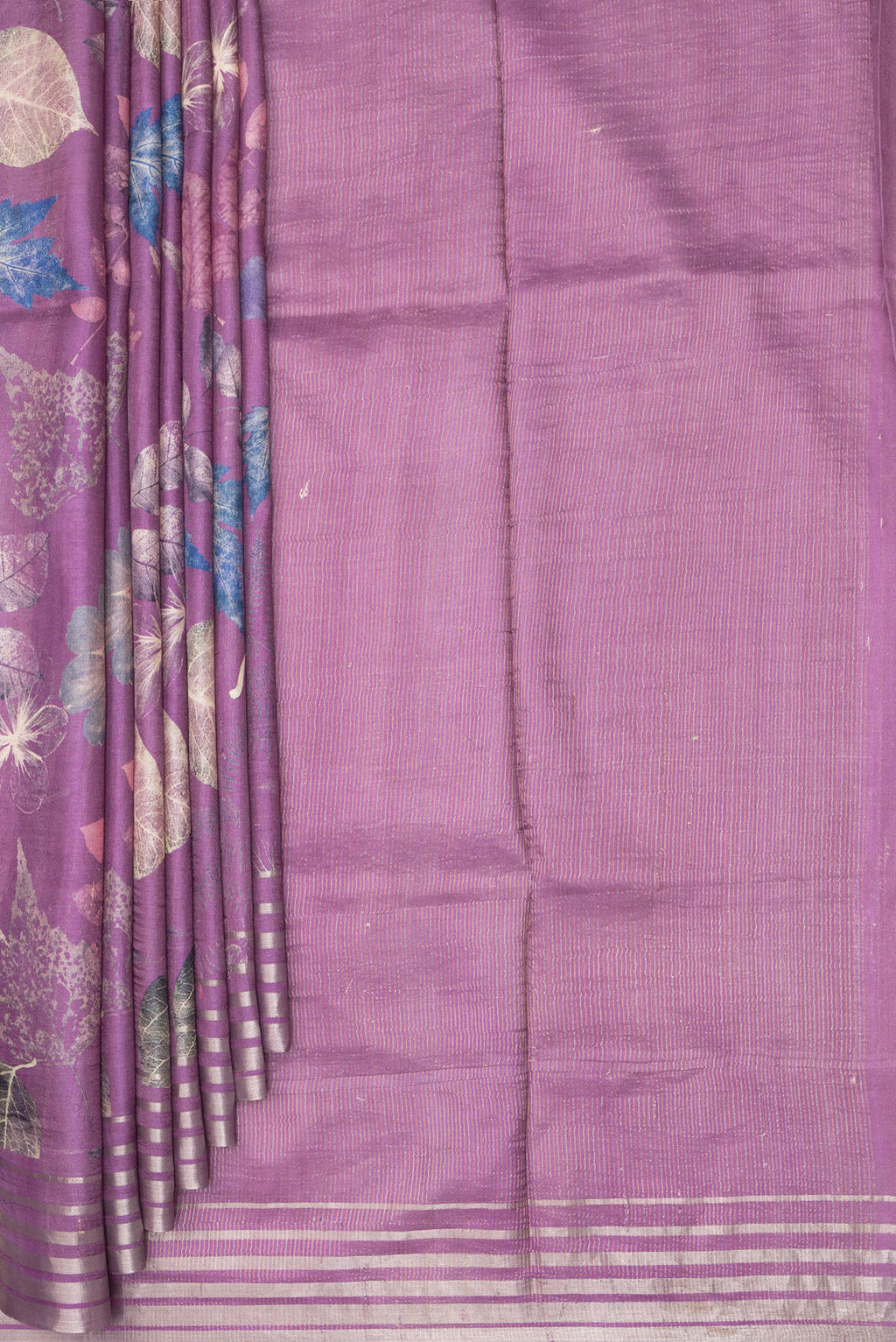 Pleats and pallu of Purple Tussar Saree with Printed design on the body and Zari Border. 