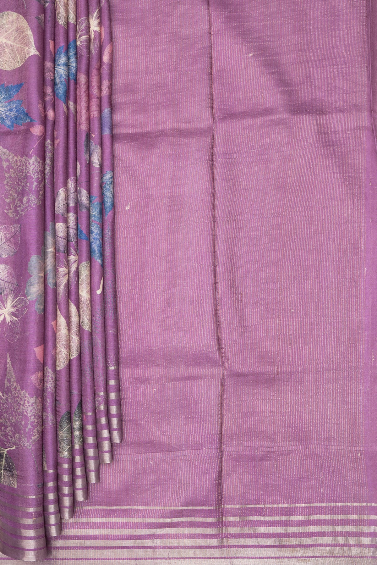 Pleats and pallu of Purple Tussar Saree with Printed design on the body and Zari Border. 