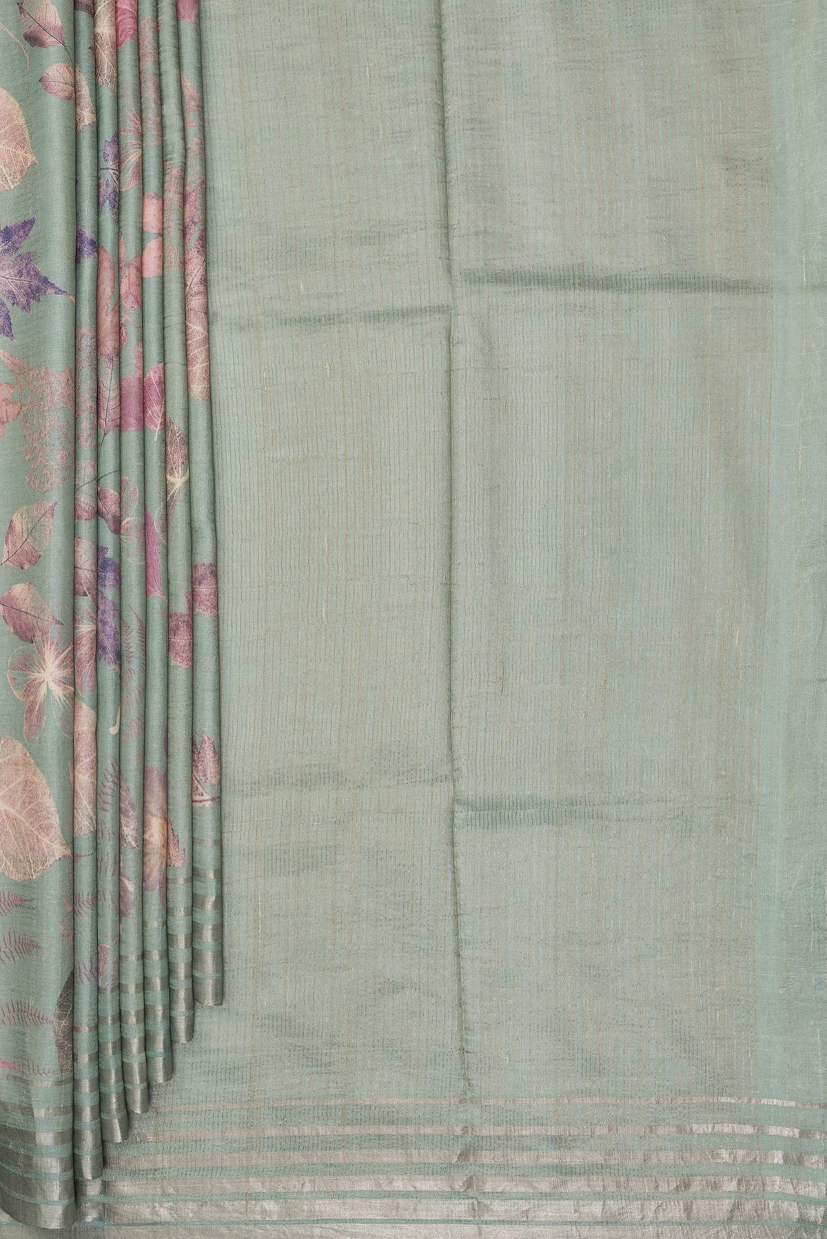 Pleats and pallu of Sage Green Tussar Saree with Printed design on the body and Thin Zari Line. 