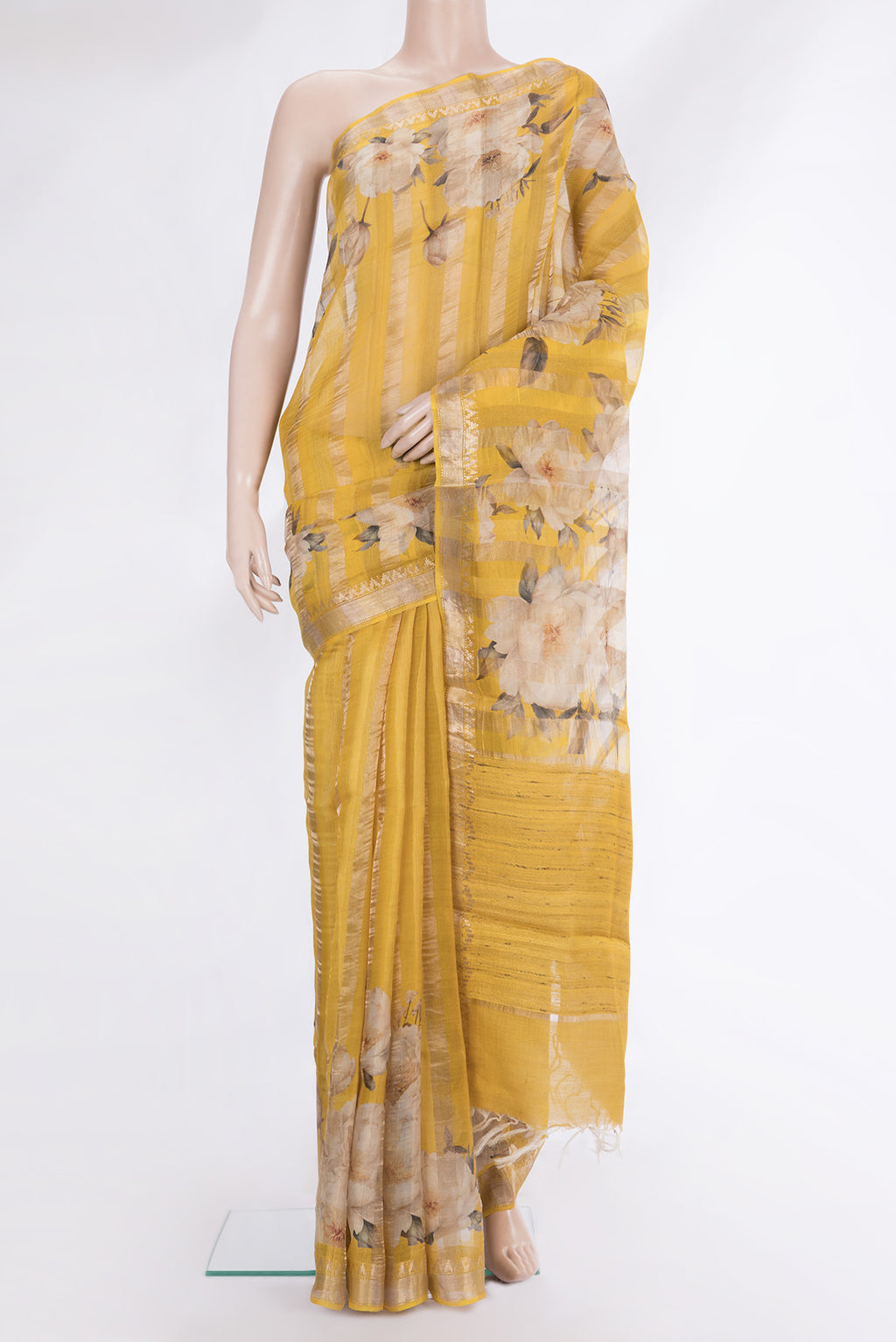 Yellow Tussar Saree with Floral Print on the body and Fancy Border.  displayed on a mannequin