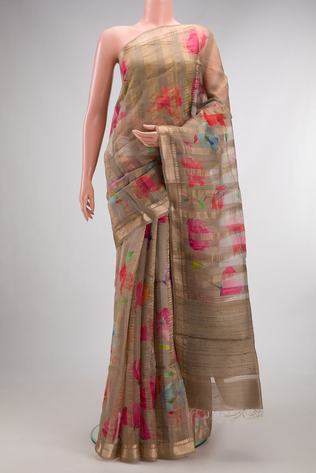 Dark Beige Tussar Saree with Stripes on the body and Zari Border.  displayed on a mannequin