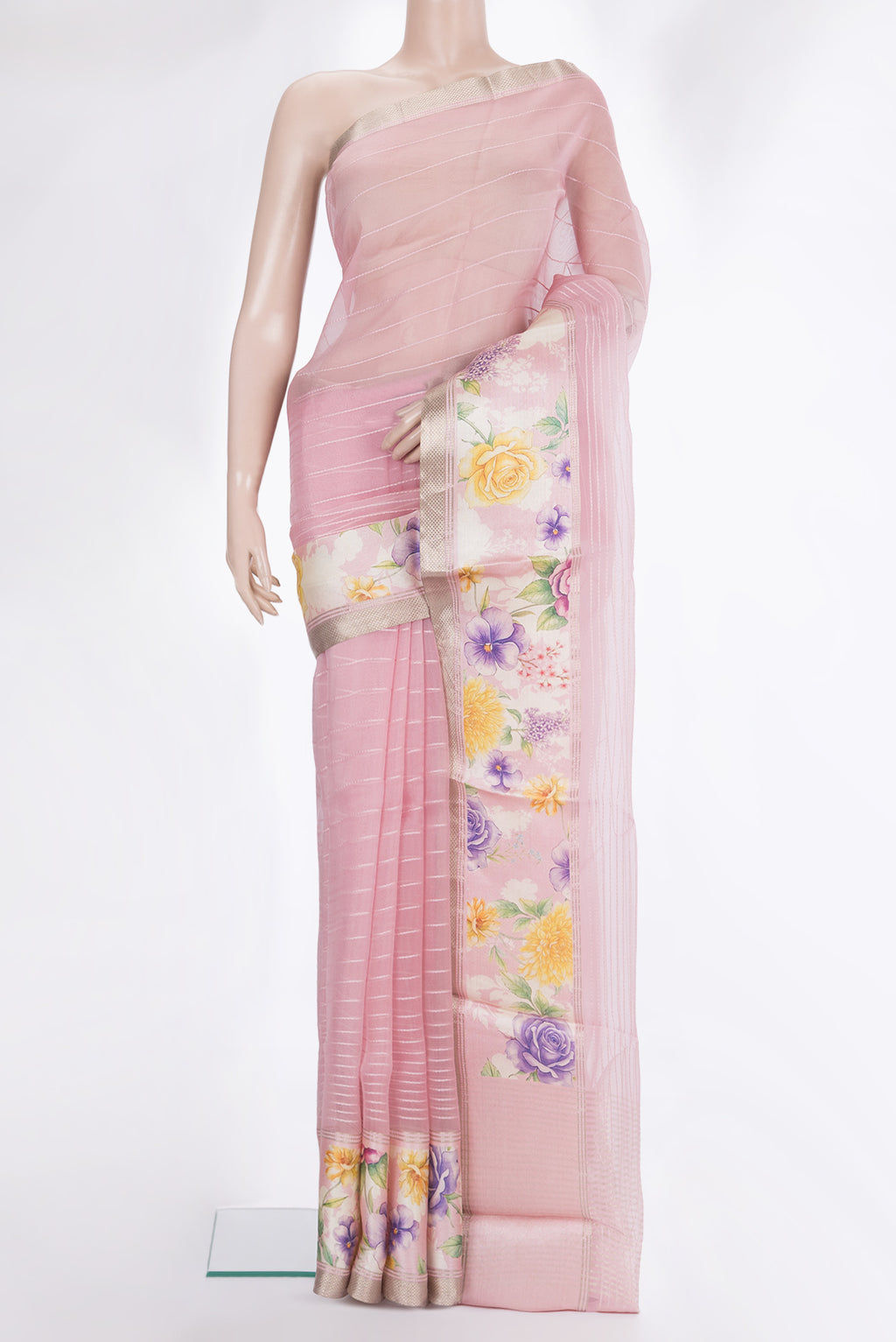 Rose pink Organza Saree with Stripes on the body and Fancy Border.  displayed on a mannequin
