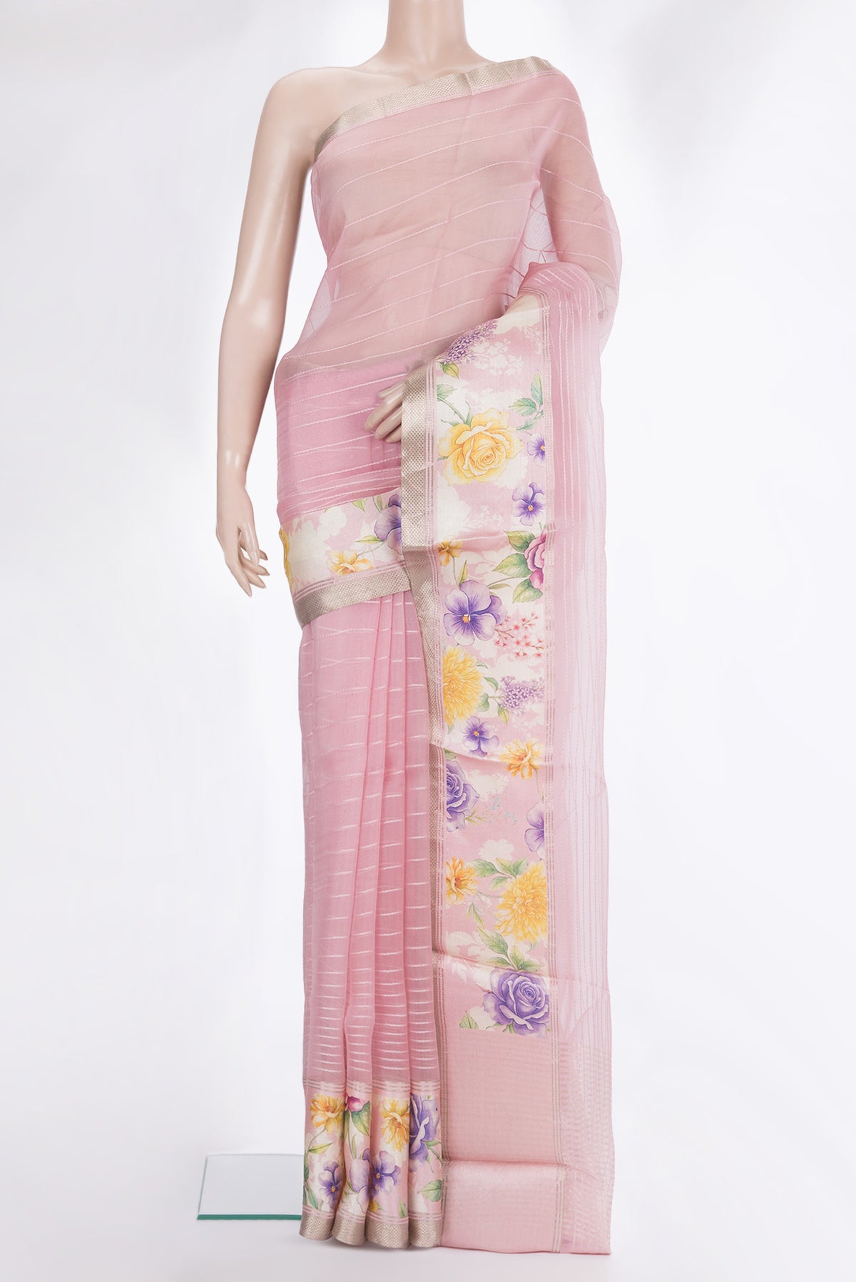 Rose pink Organza Saree with Stripes on the body and Fancy Border.  displayed on a mannequin
