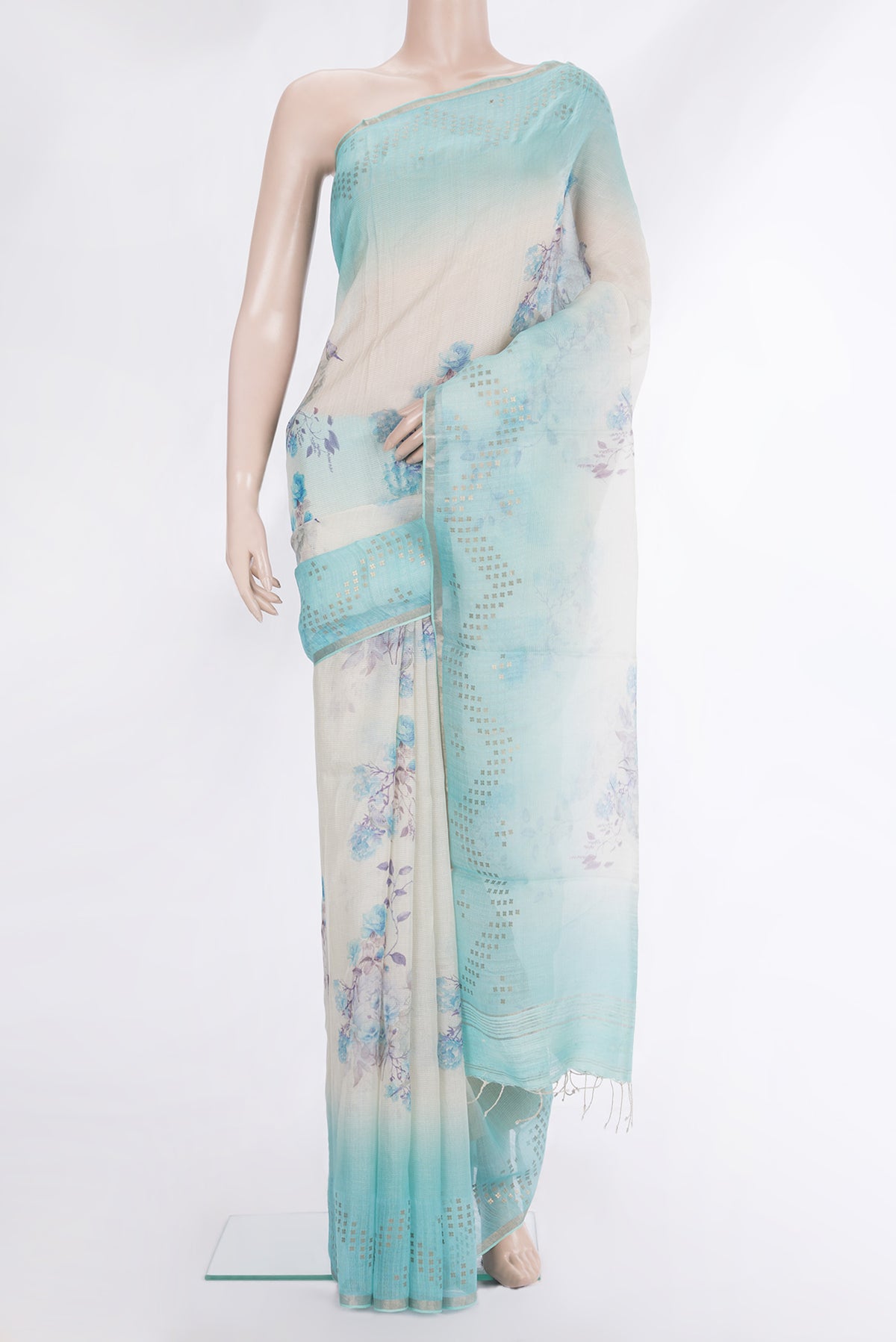 Cream Tussar Saree with Floral Print on the body and Fancy Border.  displayed on a mannequin