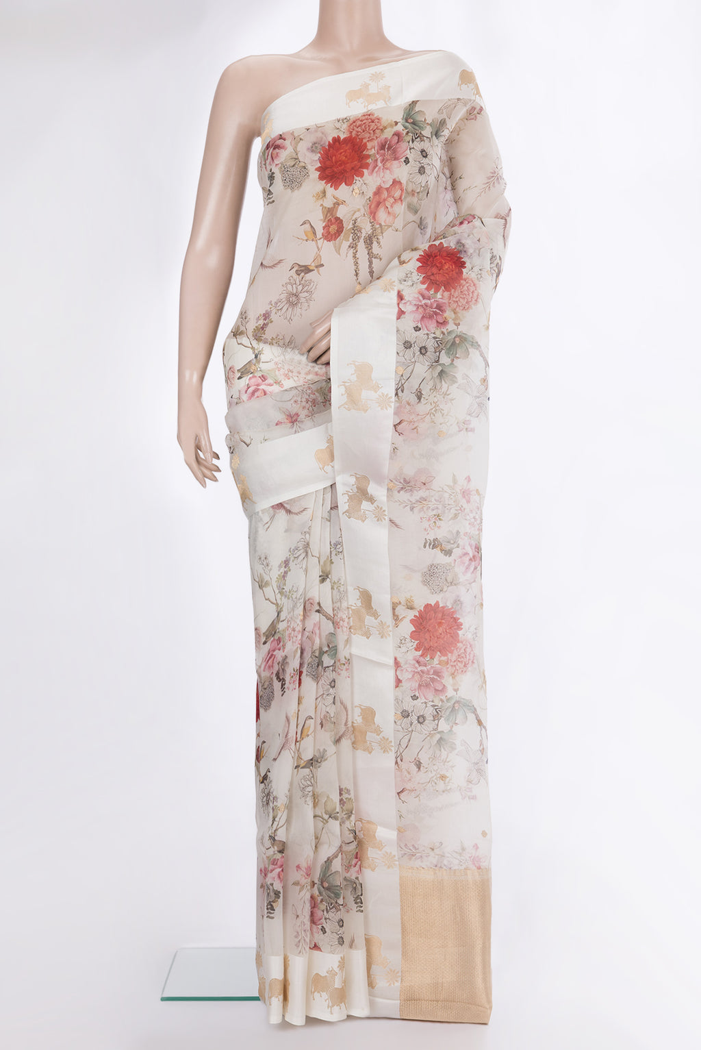 Off White Organza Saree with Floral Print on the body and Fancy Border.  displayed on a mannequin