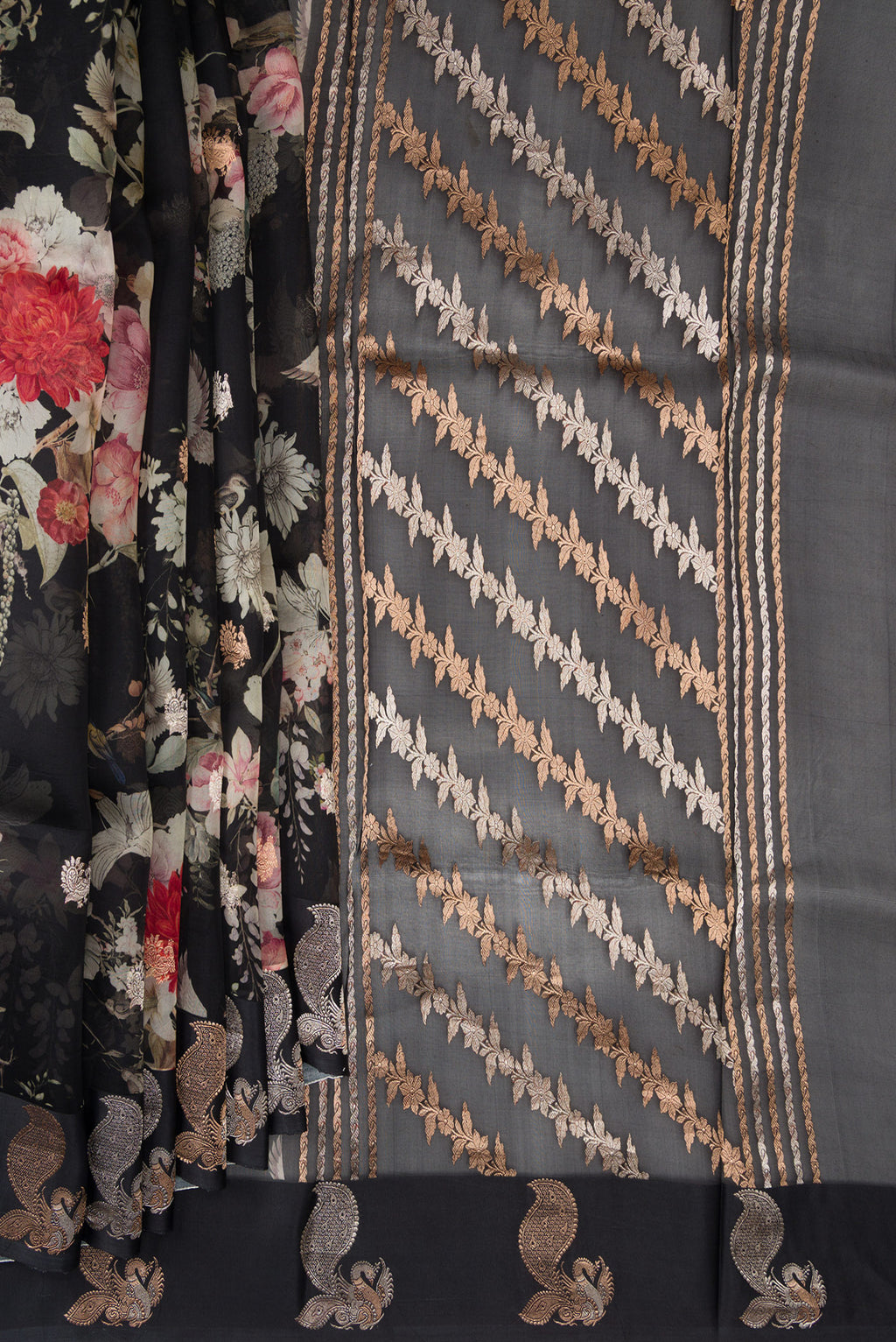 Pleats and pallu of Black Organza Saree with Floral Print on the body and Fancy Border. 