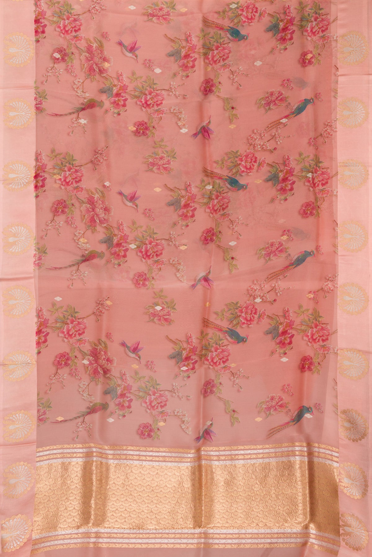 Flat view of Golden Peach Organza Saree with Printed design on the body and Fancy Border. 