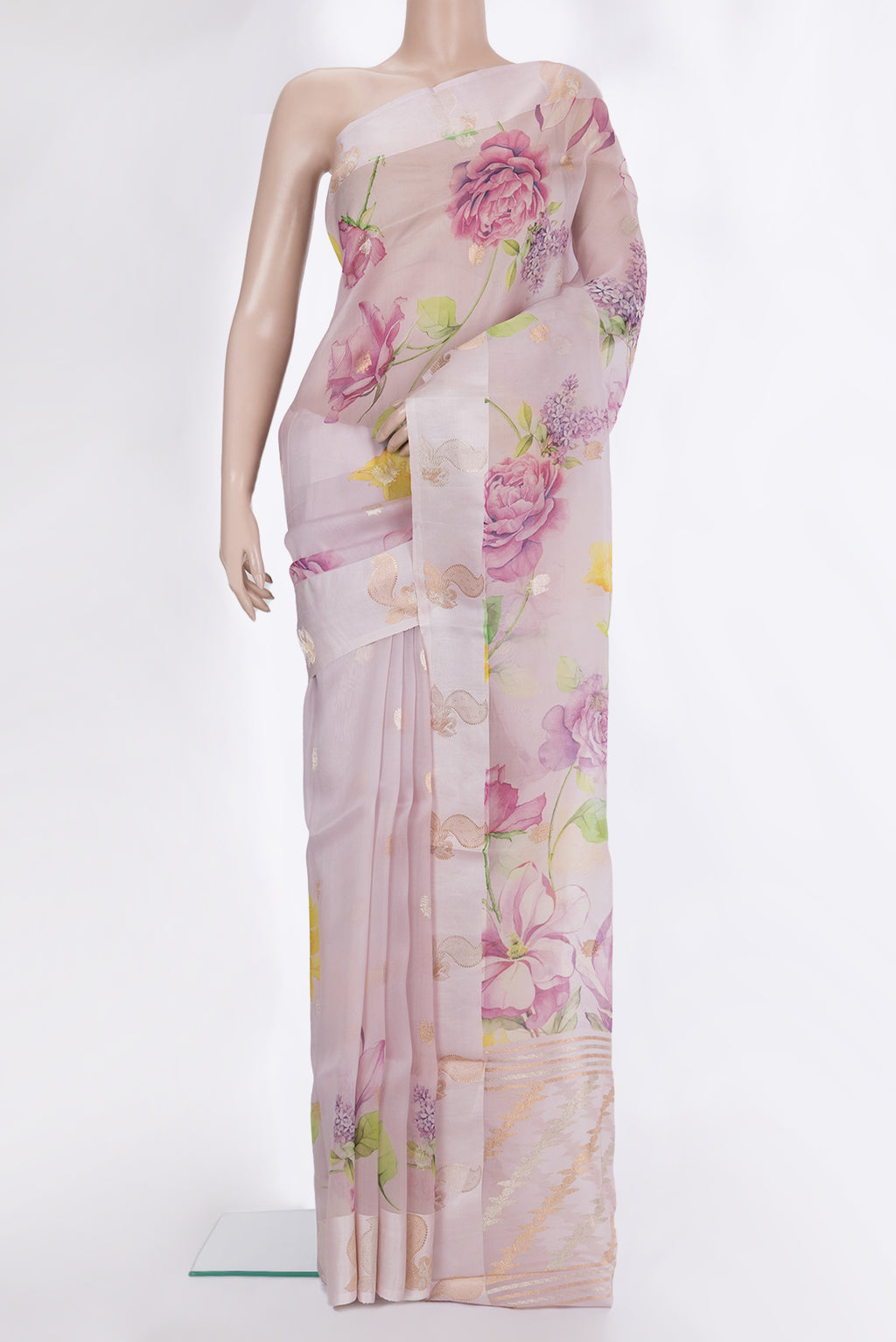 Rose Gold Organza Saree with Floral Print on the body and Fancy Border.  displayed on a mannequin