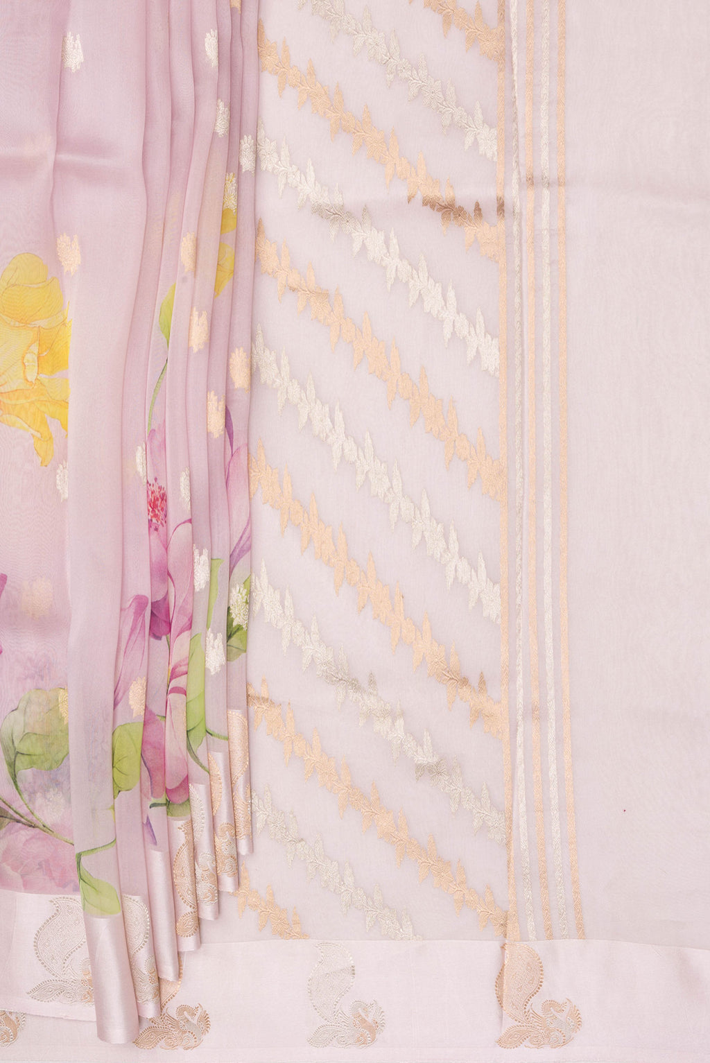 Pleats and pallu of Rose Gold Organza Saree with Floral Print on the body and Fancy Border. 