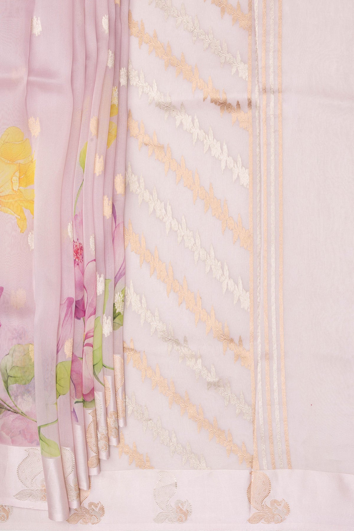 Pleats and pallu of Rose Gold Organza Saree with Floral Print on the body and Fancy Border. 