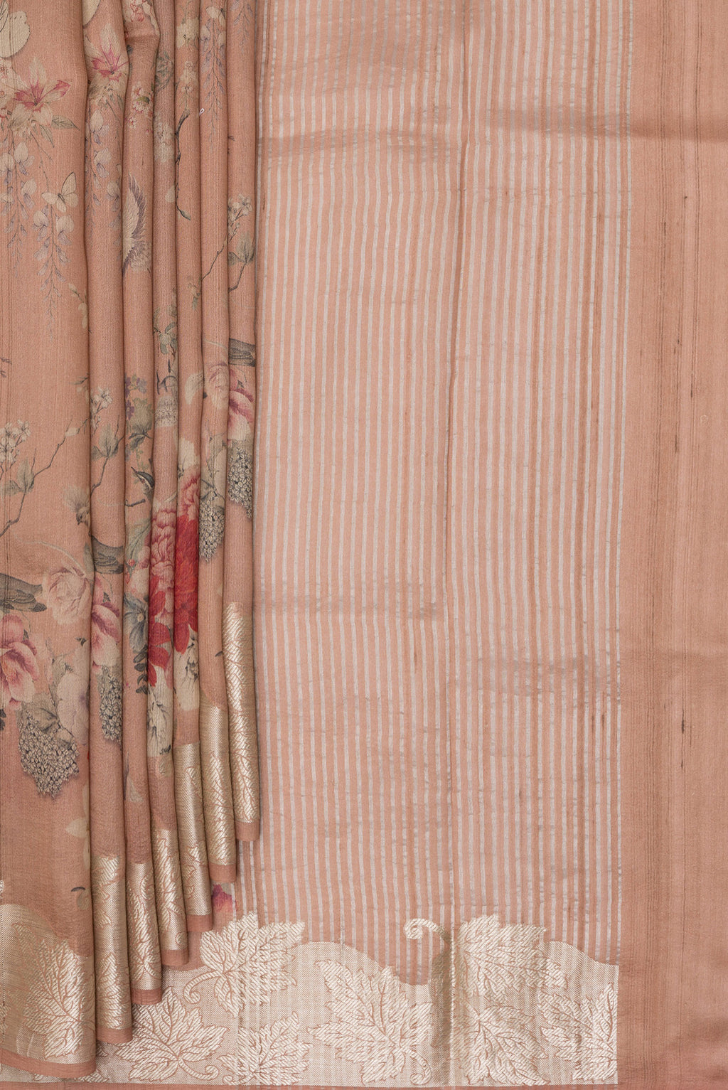 Pleats and pallu of Rose Gold Tussar Saree with Floral Print on the body and Zari Border. 