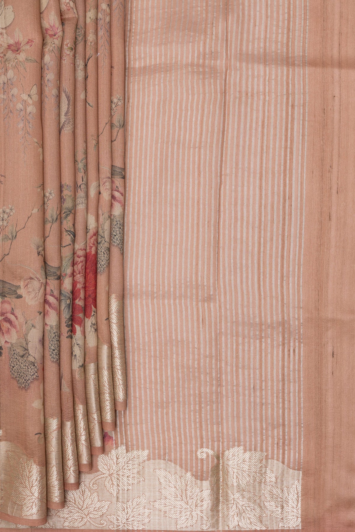 Pleats and pallu of Rose Gold Tussar Saree with Floral Print on the body and Zari Border. 