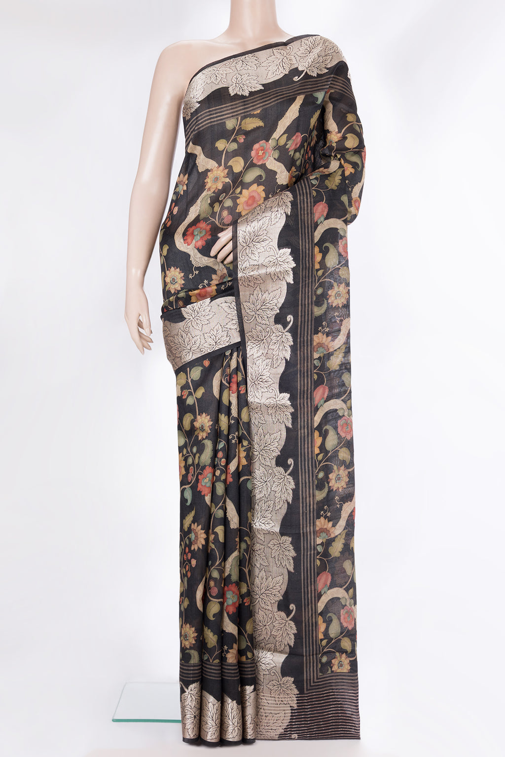 Pure Silk Black Tussar Saree with Printed design on the body and Fancy Border.  displayed on a mannequin