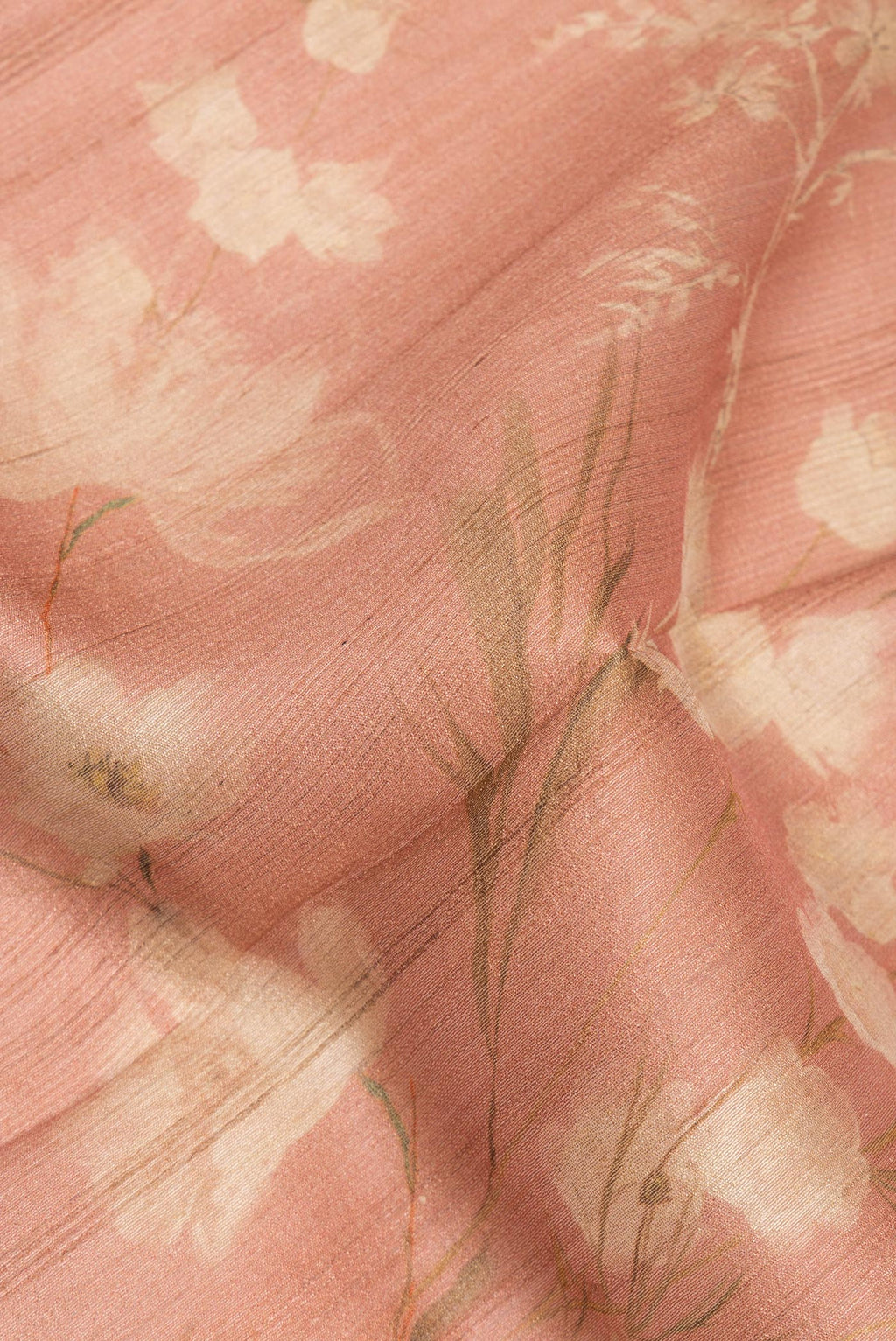 Close up of Golden Peach Dual Tone Tussar Saree with Printed design on the body and Fancy Border.  displaying folds