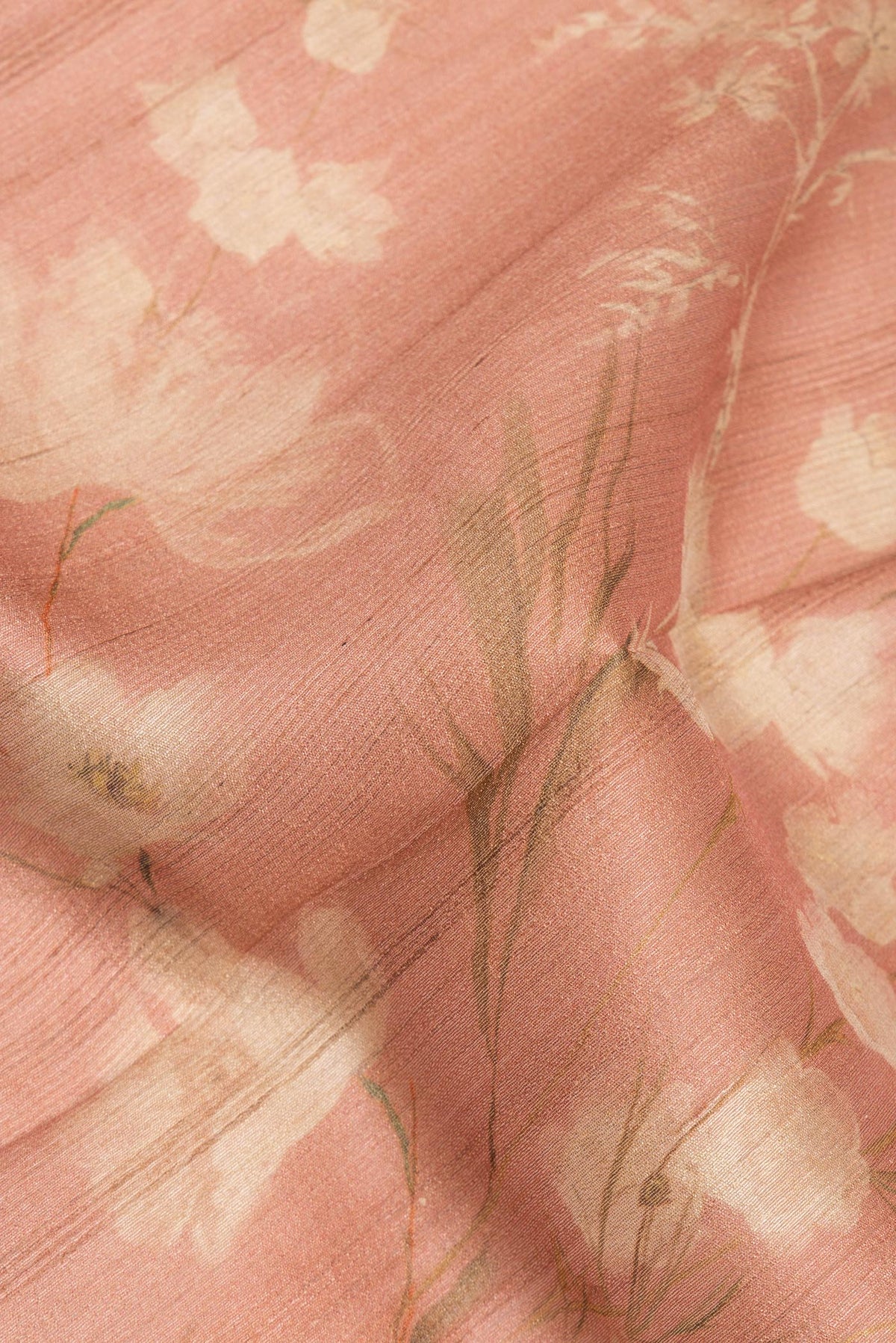Close up of Golden Peach Dual Tone Tussar Saree with Printed design on the body and Fancy Border.  displaying folds