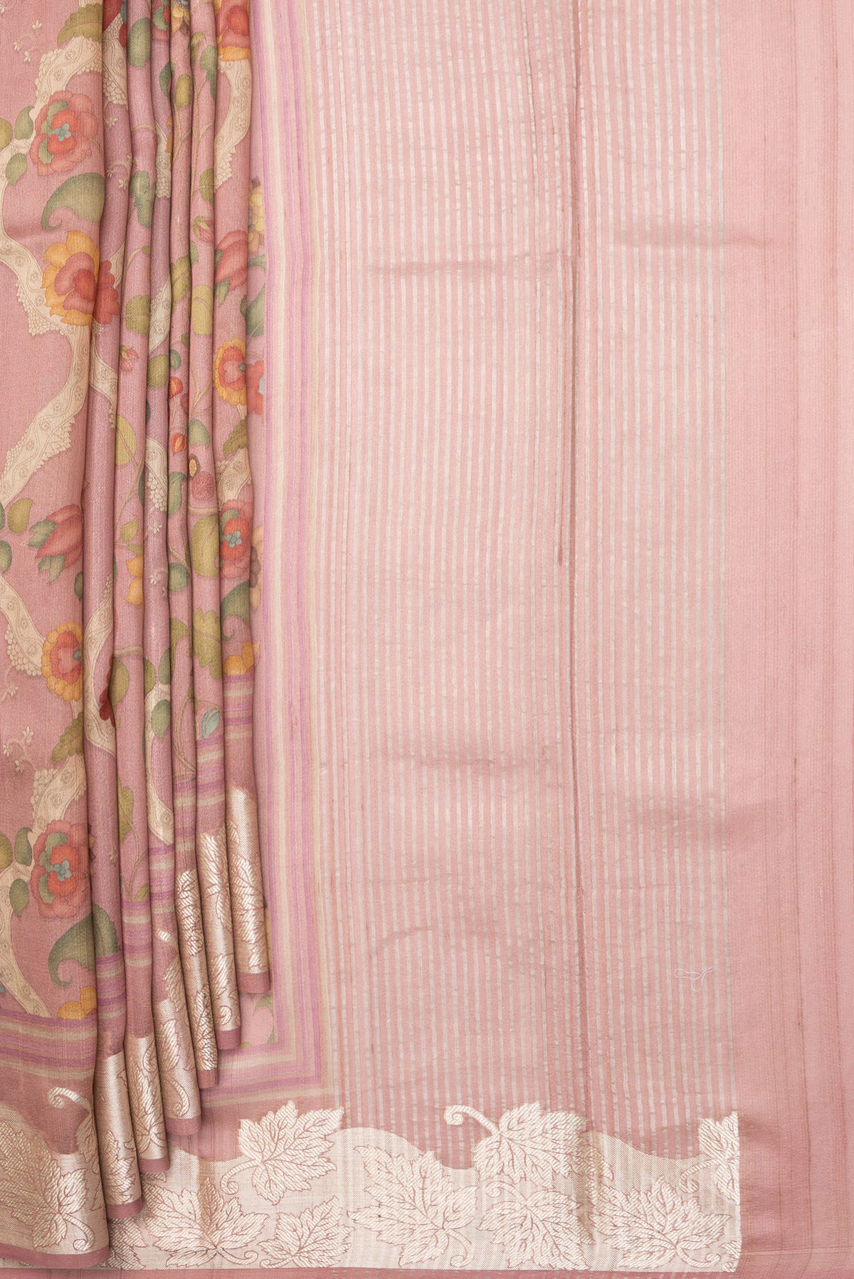 Pleats and pallu of Peach Tussar Saree with Printed design on the body and Zari Border. 