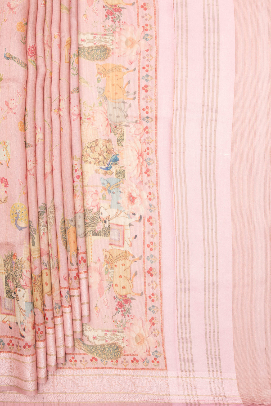 Pleats and pallu of Peach Tussar Saree with Printed design on the body and Thread Border. 