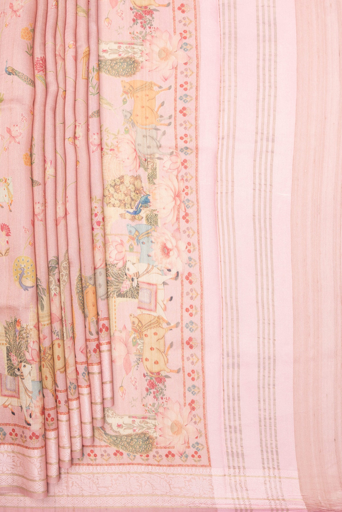 Pleats and pallu of Peach Tussar Saree with Printed design on the body and Thread Border. 