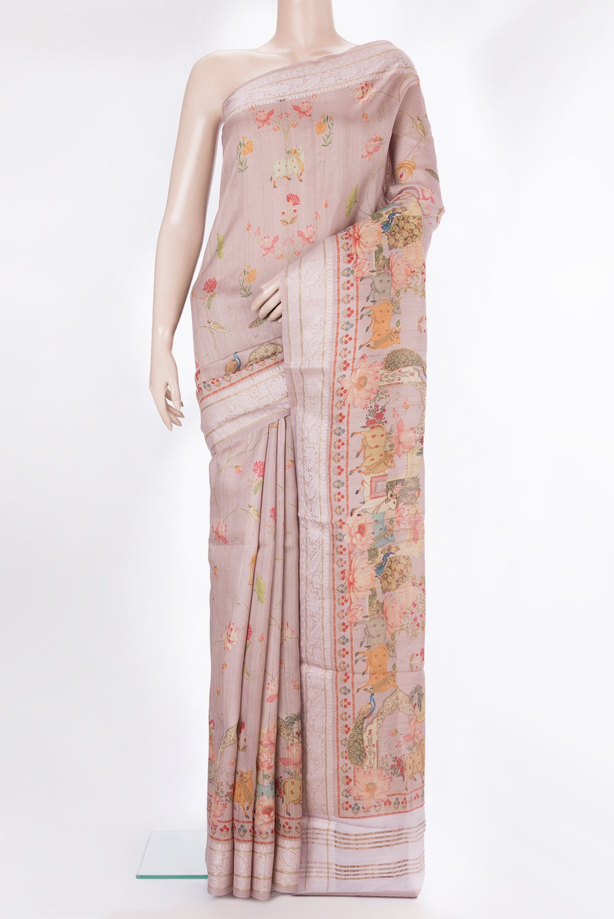 Rose Gold Tussar Saree with Printed design on the body and Thread Border.  displayed on a mannequin