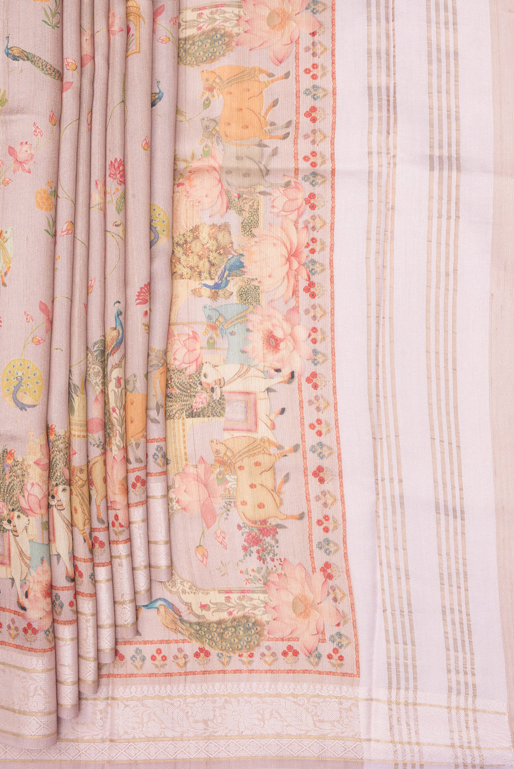 Pleats and pallu of Rose Gold Tussar Saree with Printed design on the body and Thread Border. 
