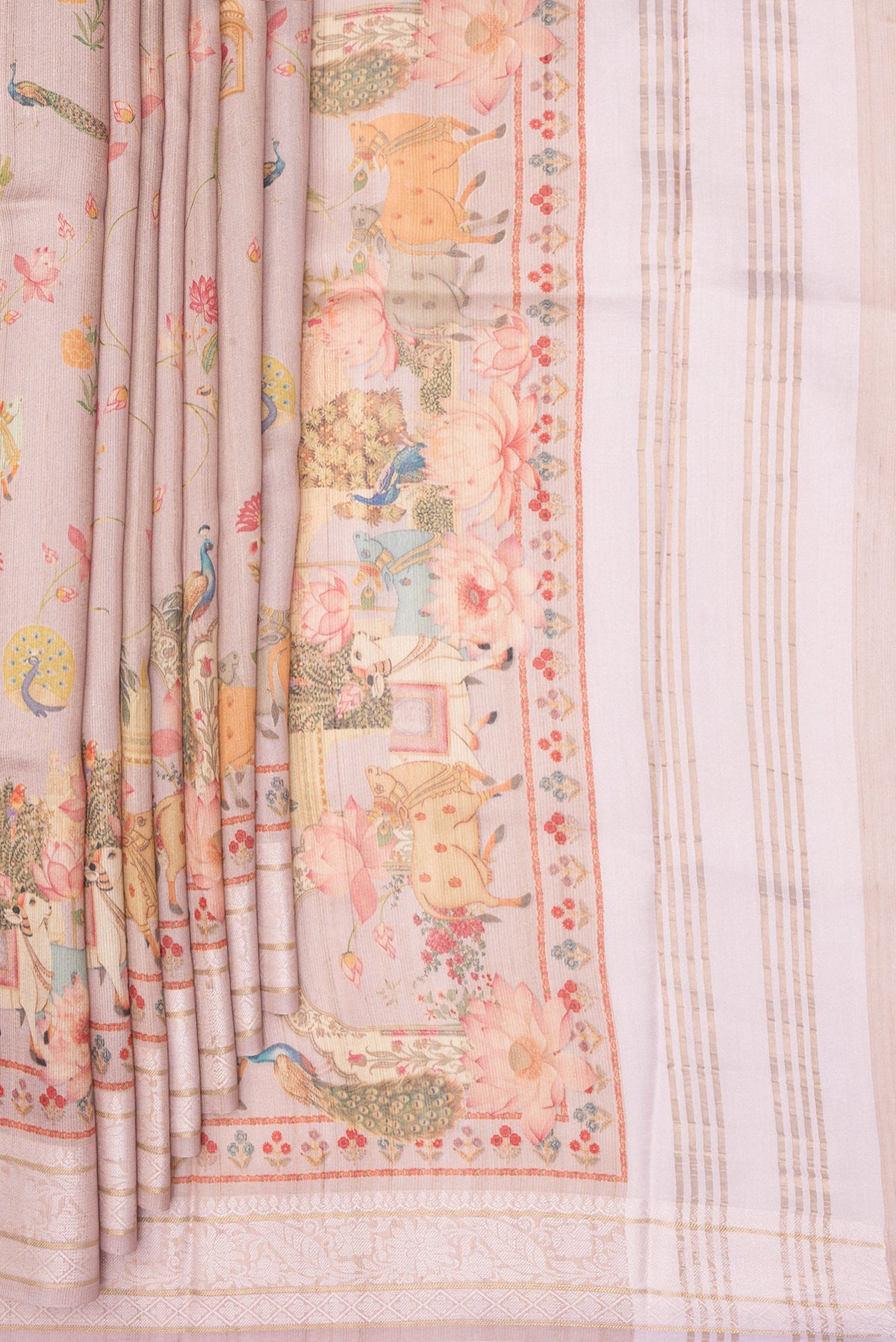 Pleats and pallu of Rose Gold Tussar Saree with Printed design on the body and Thread Border. 