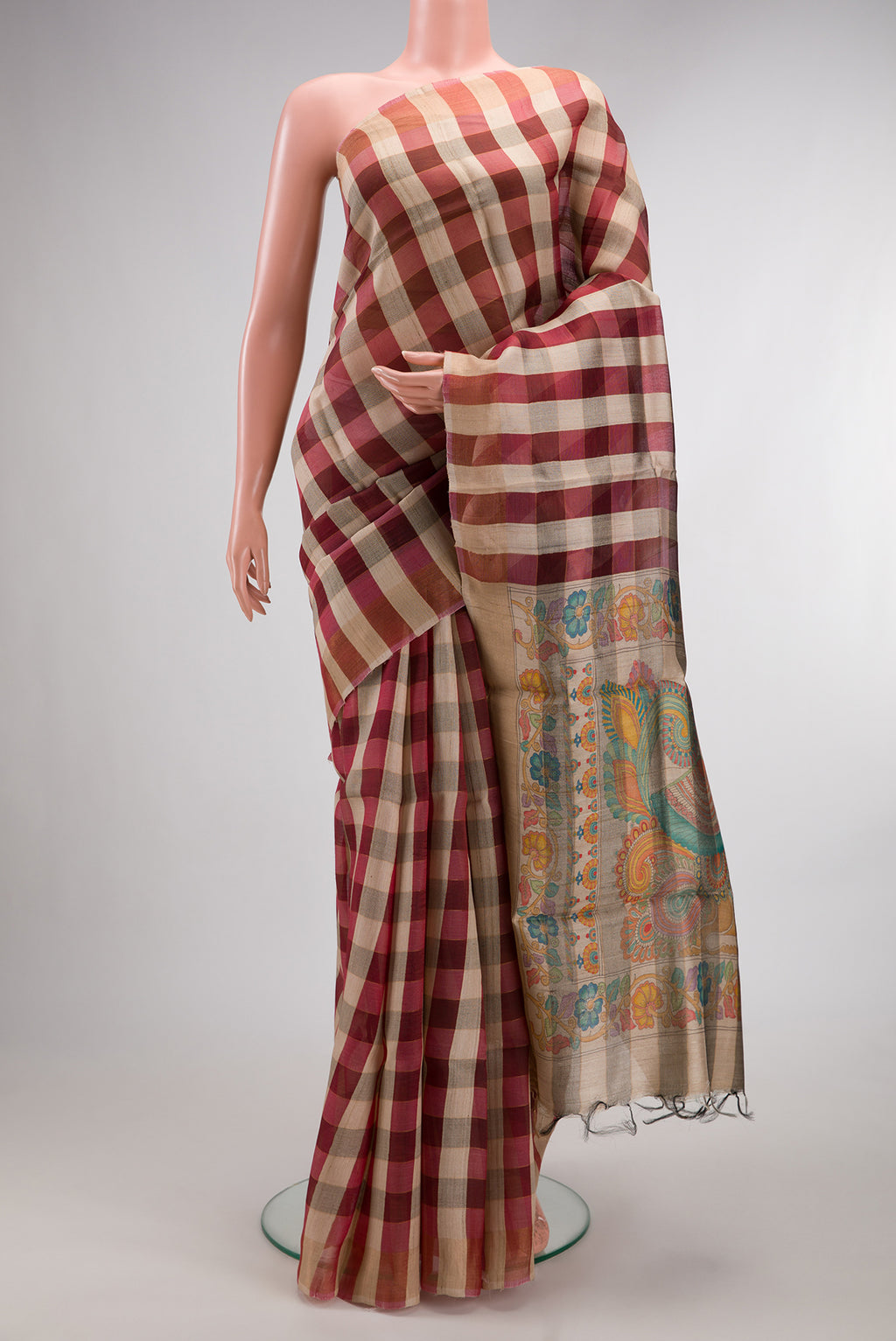 Multi Color Tussar Saree with Checked design on the body and Zari Border.  displayed on a mannequin