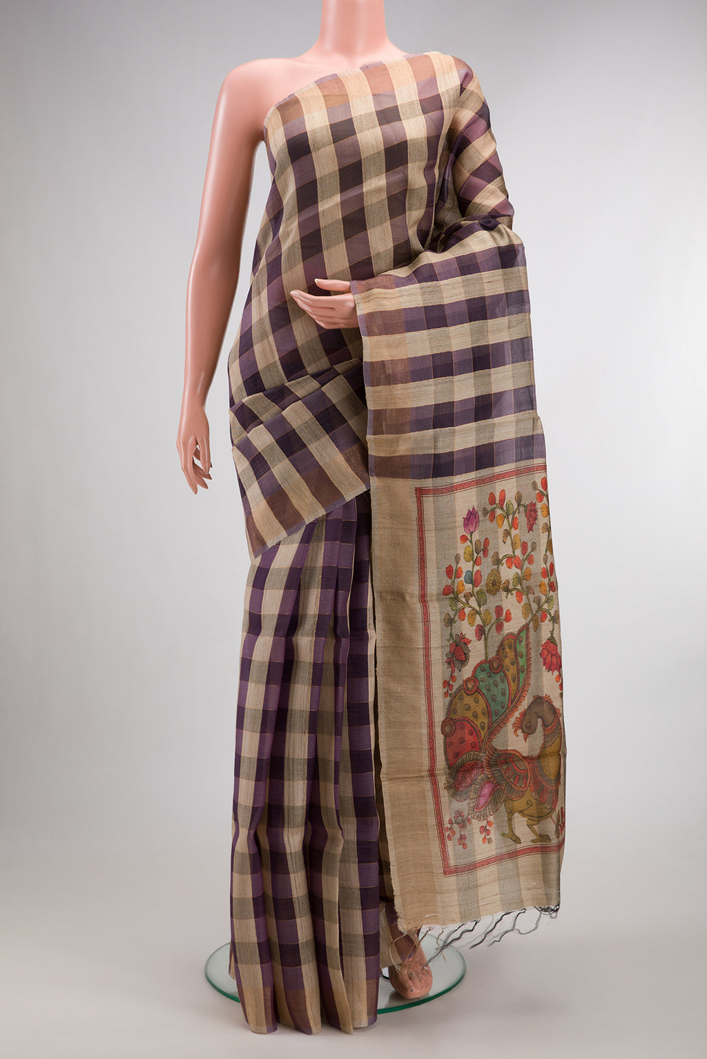 Multi Color Tussar Saree with Checked design on the body and Zari Border.  displayed on a mannequin