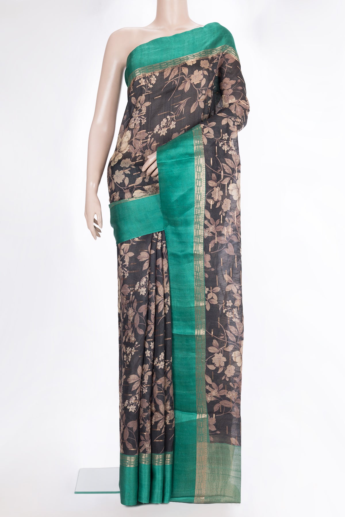 Pure Silk Black Tussar Saree with Printed design on the body and Zari Border.  displayed on a mannequin