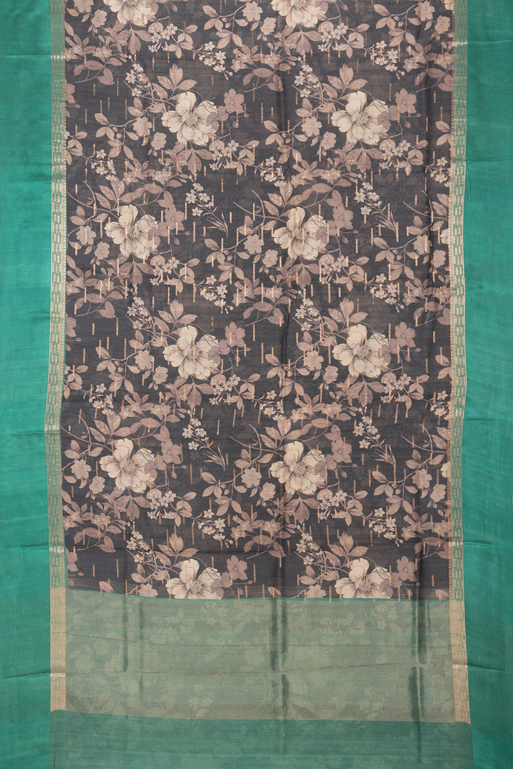 Flat view of Pure Silk Black Tussar Saree with Printed design on the body and Zari Border. 