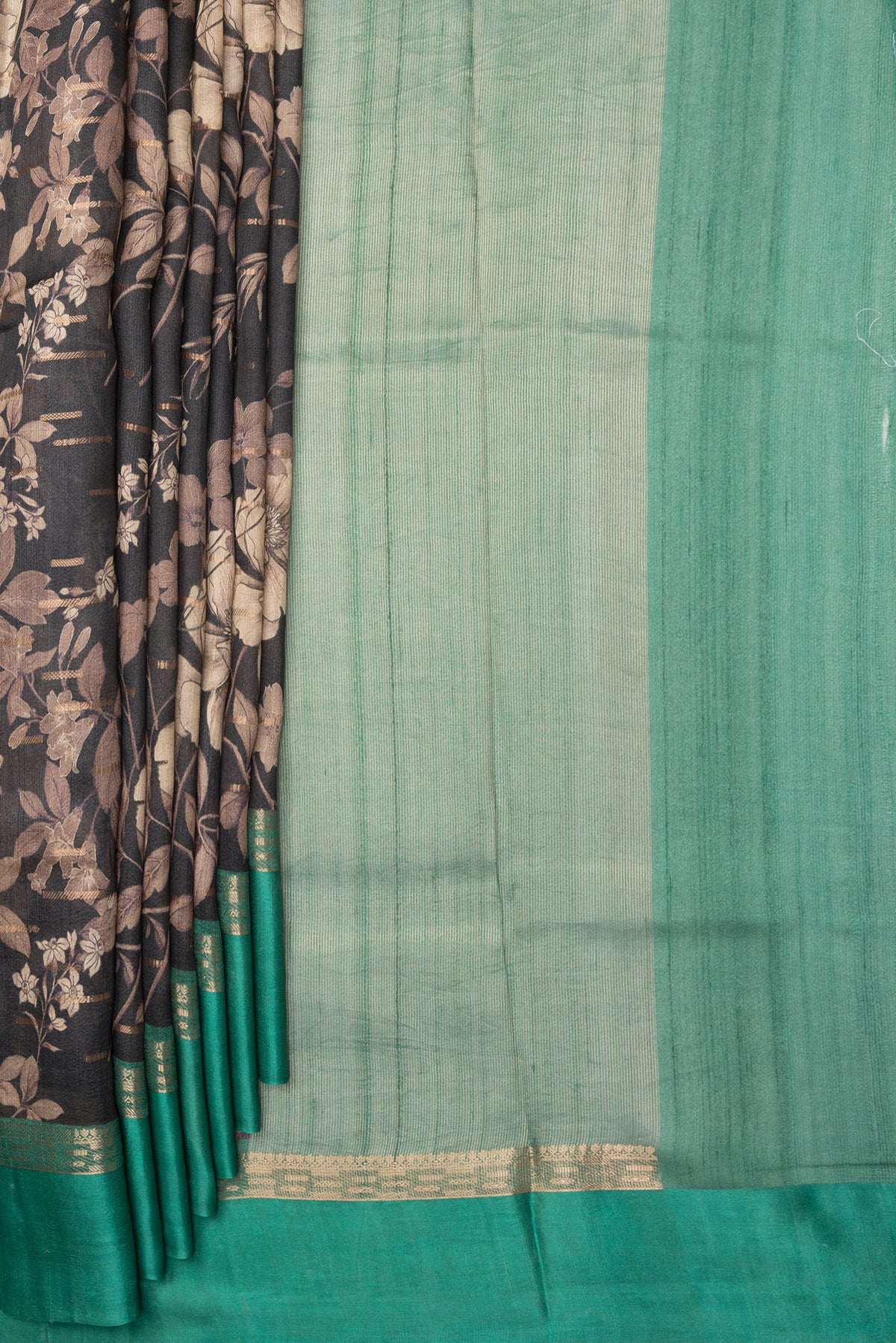 Pleats and pallu of Pure Silk Black Tussar Saree with Printed design on the body and Zari Border. 