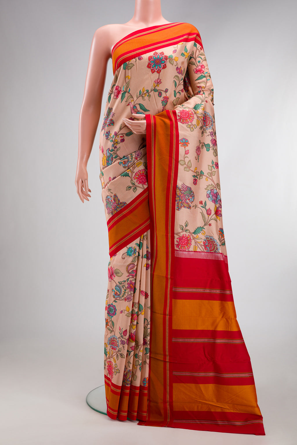 Peach Kanchipuram Silk Saree with Printed design on the body and Plain Border.  displayed on a mannequin