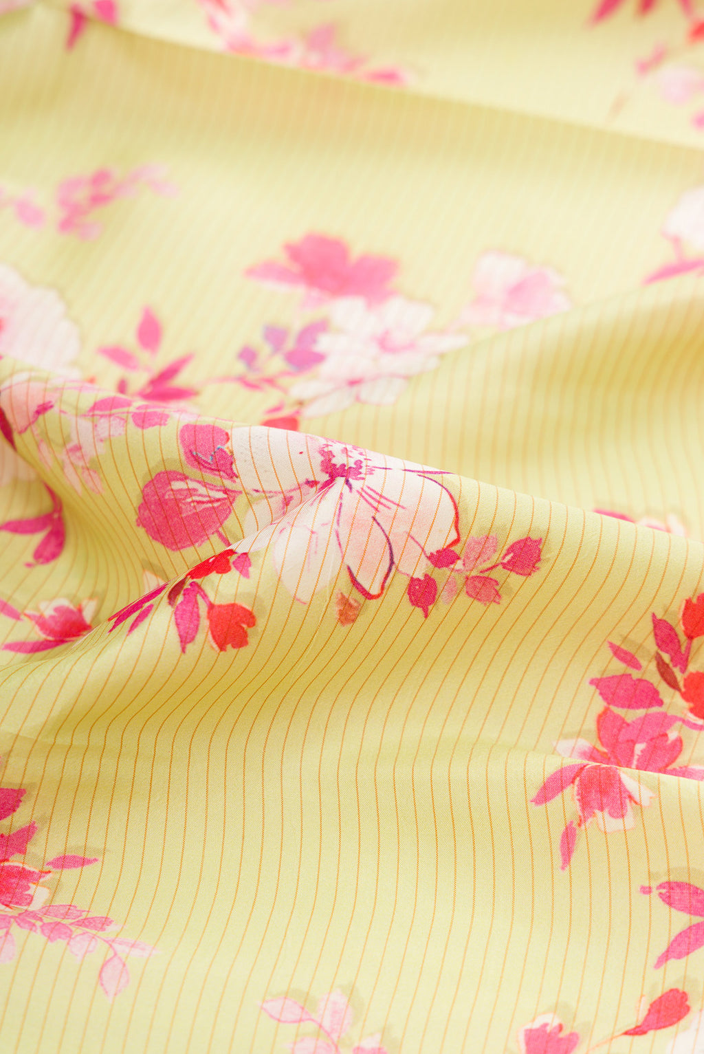 Close up of Pista Green Kanchipuram Silk Saree with Printed design on the body and Plain Border.  displaying folds