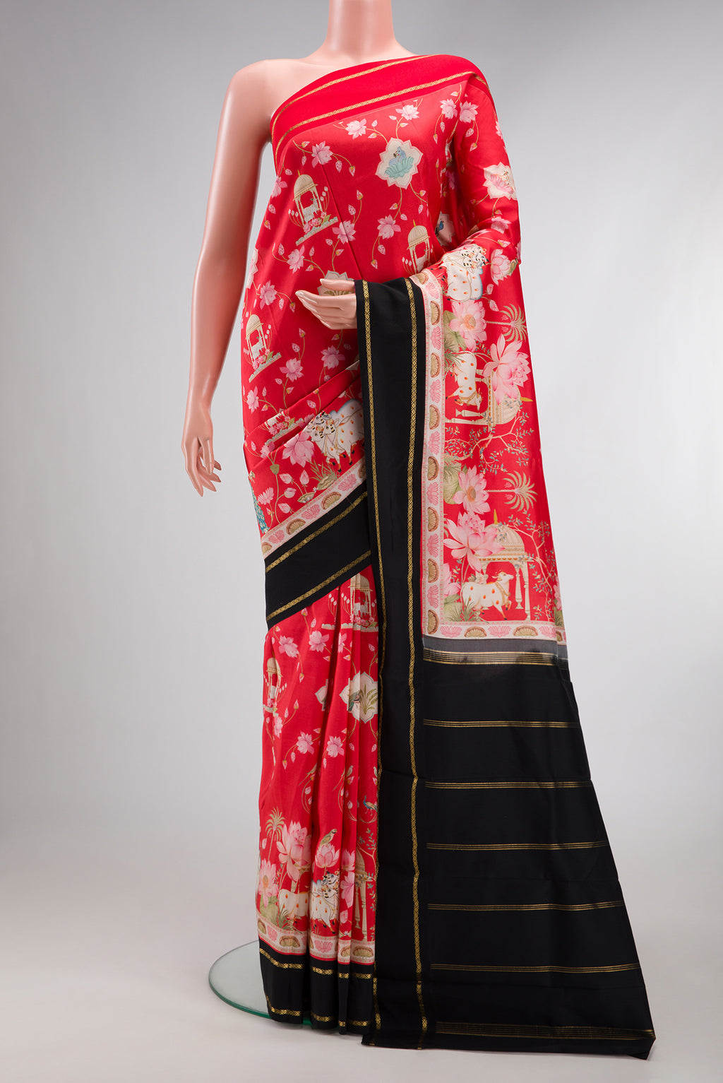 Red Kanchipuram Silk Saree with Printed design on the body and Plain Border.  displayed on a mannequin
